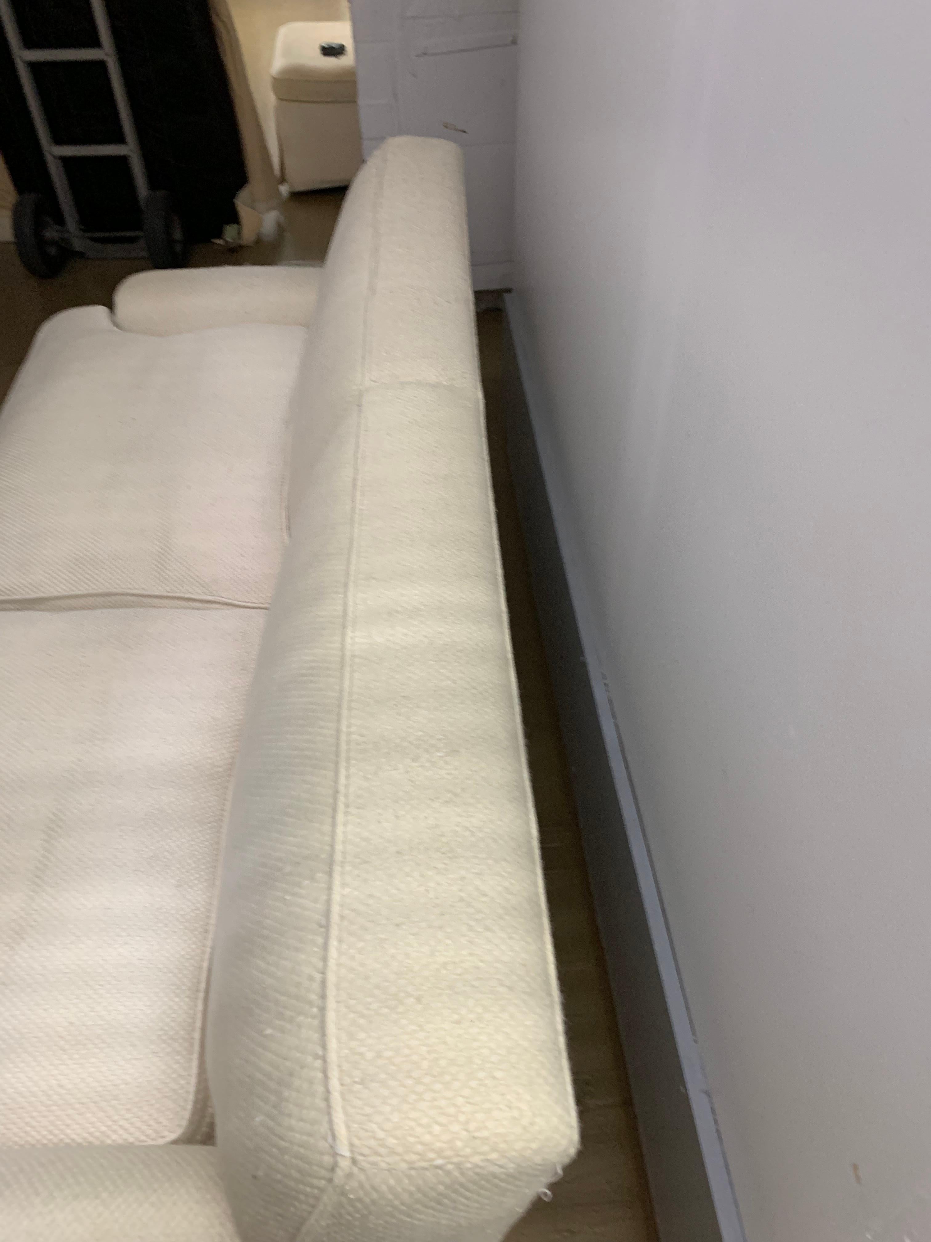 Midcentury Baker upholstered two-seat sofa or love seat
Our living room furniture from our childhood home included this upholstered sofa along with an upholstered armchair and love seat of the same aesthetic
upholstery is white cotton blend and