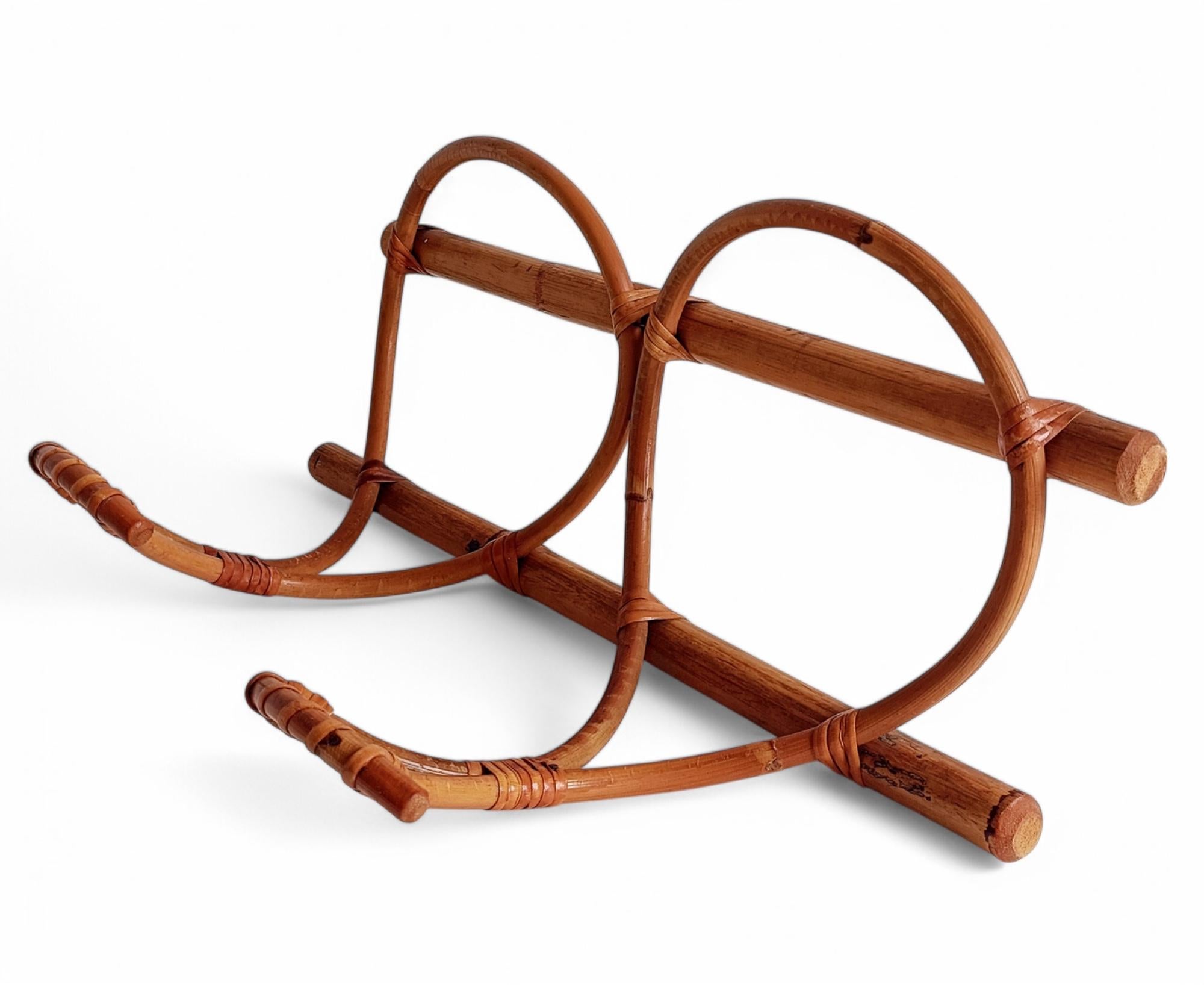 French Riviera Bamboo and Rattan Coat Rack with Hangers

Handmade in the 1960s, this bamboo and rattan coat rack is designed in the style of Franco Albini and Franca Helg. It features two matching hangers and a lightweight yet sturdy frame, making