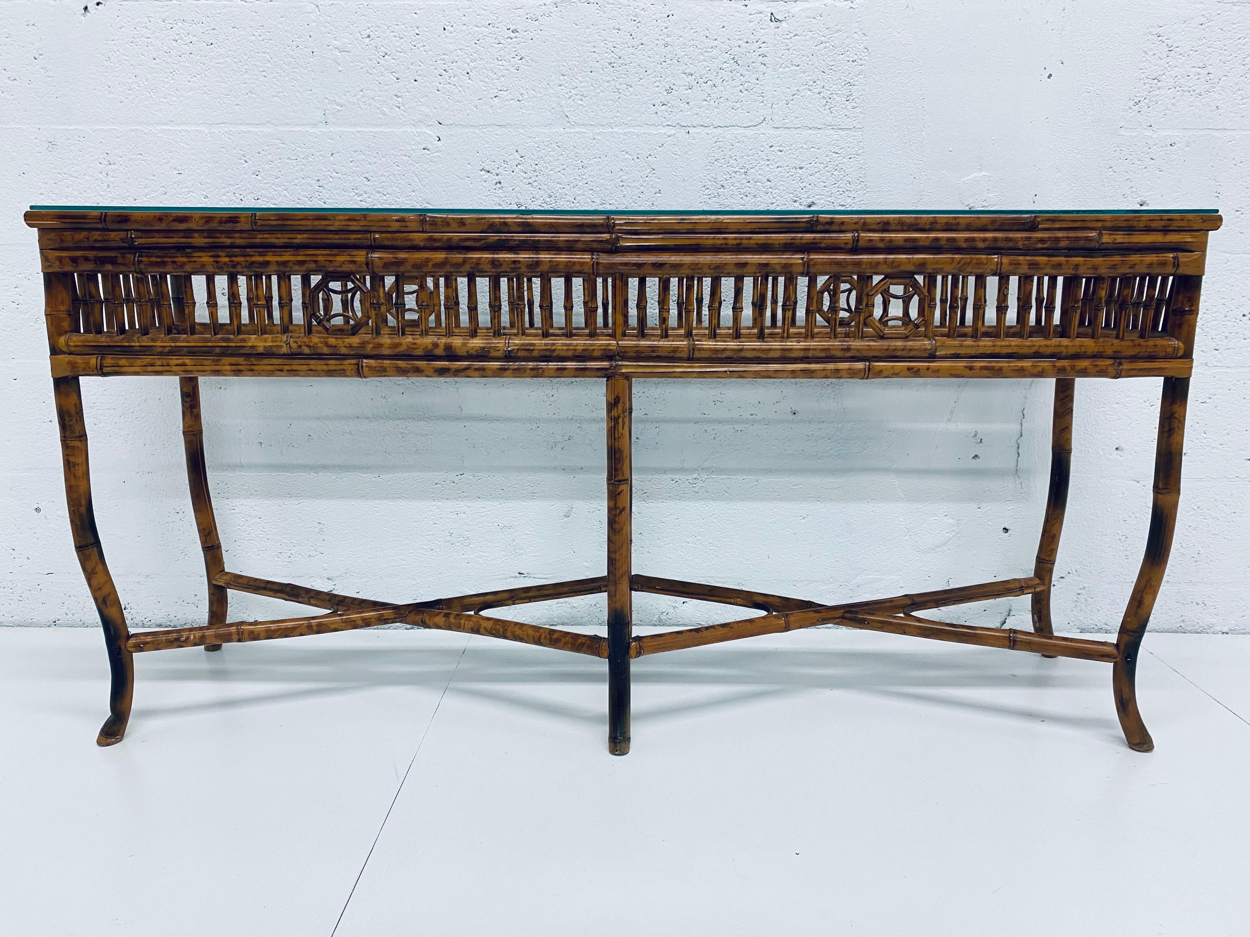 Midcentury Regency console table made of bamboo with a burnt tortoise finish from the 1970s.
