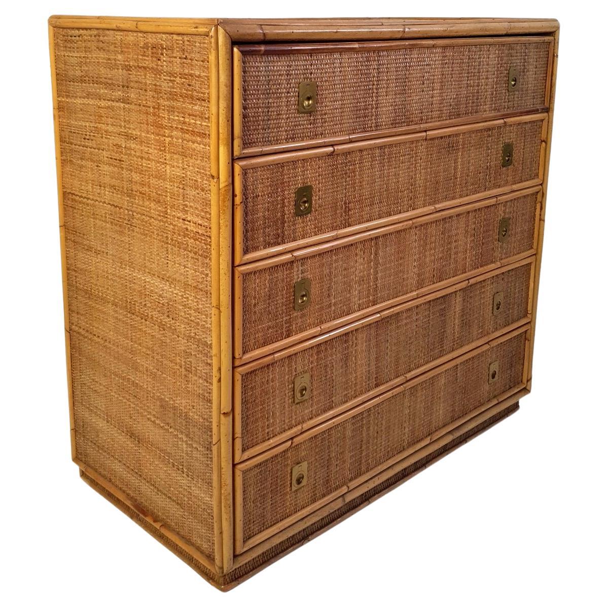 This is a bamboo and wicker dresser from the 1970's by Italian brand Vivai del Sud. It comes with five spacious drawers and smart brass fittings. In very nice condition and of high quality production.

Brothers Giorgio, Gianfranco and Piero di