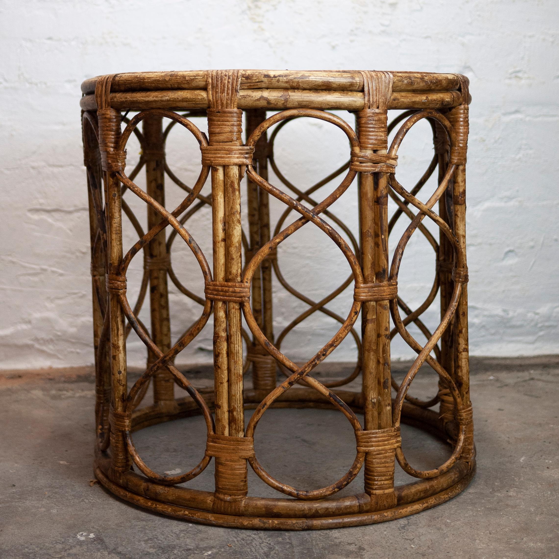 A woven bamboo and cane side table from the 1960s.

Manufacturer - Unknown

Design Period - 1960 to 1969

Style - Vintage, Mid-Century

Detailed Condition - Good with minimal defects.

Restoration and Damage Details - Light wear consistent