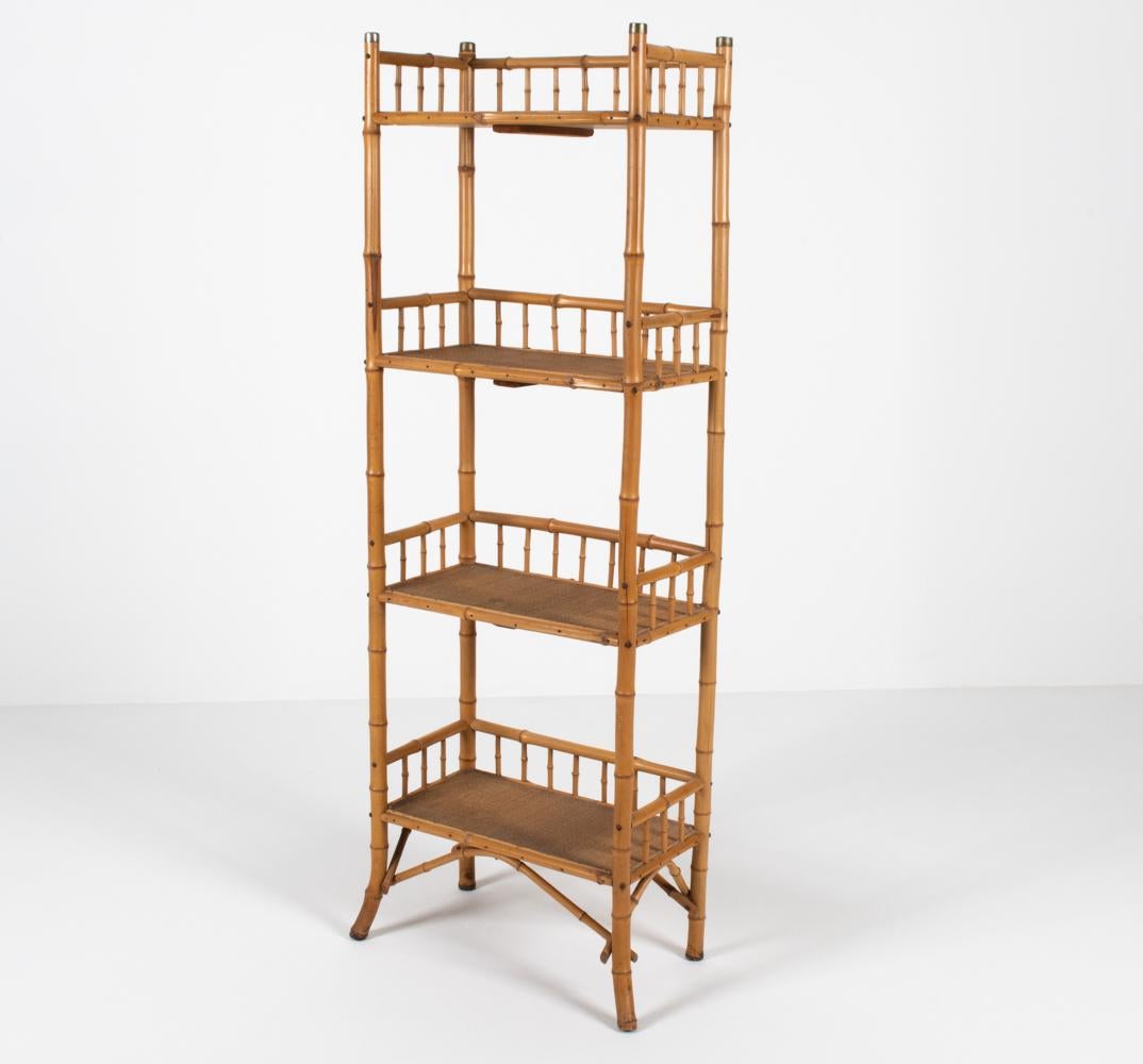 This mid-century etagere offers a modern take on the traditional Victorian bamboo stand, with clean, straight lines and brass cap details. A fabulous offering for Palm Beach Regency or Scandinavian interiors alike, in the manner of R. Wengler, known