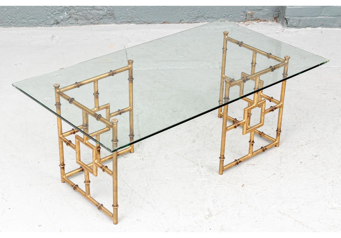 A fine rectangular gilt metal cocktail table with bamboo form having darker patinated color flanking the ringed elements and highlighting the geometric design. The 3/8