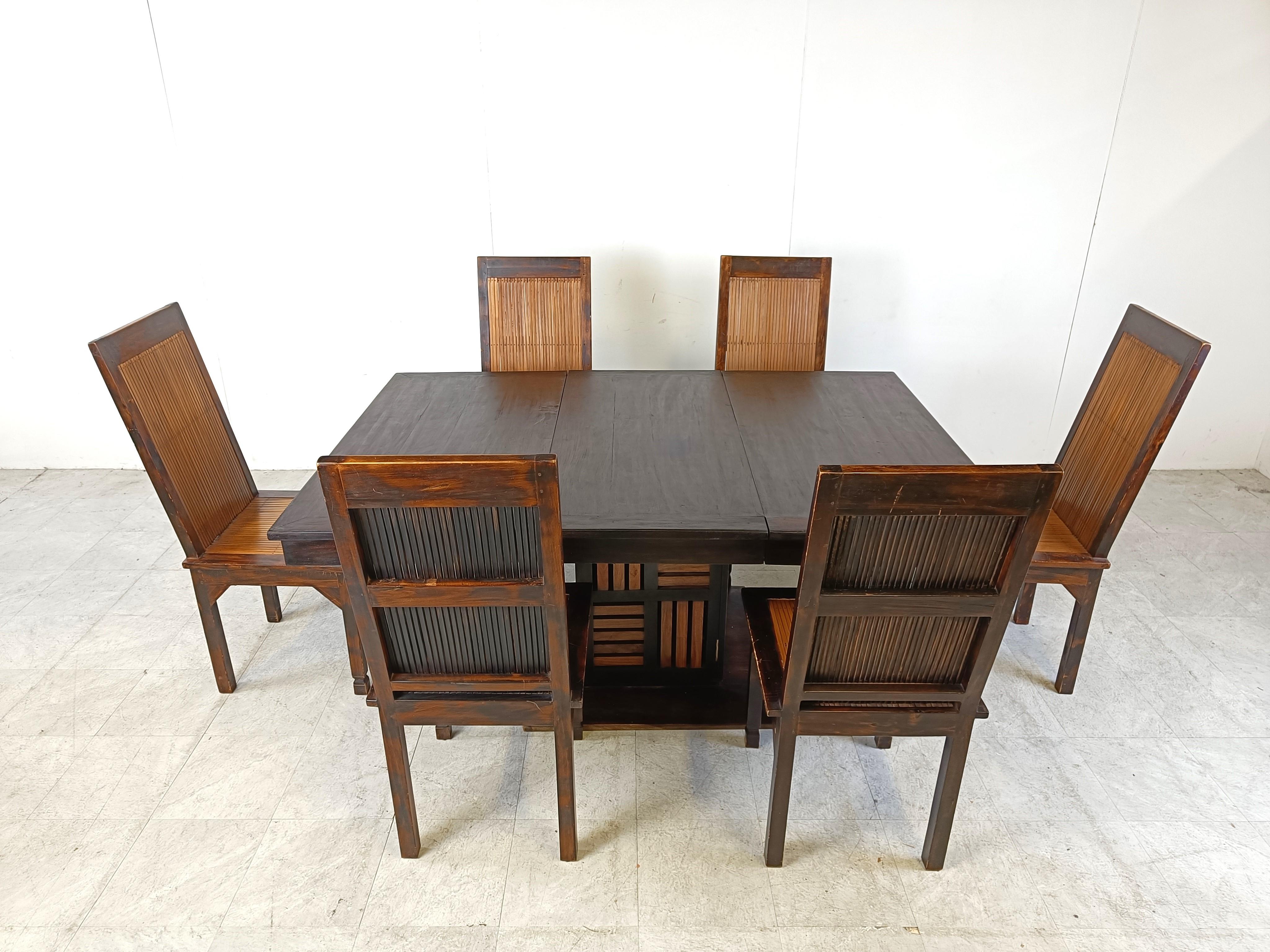Ethnic dining set consisting of an extendable dining table with a storage compartment and six dining chairs

Beautiful set made from exotic wood and bamboo reeded seats and backrests.

Very well made and sturdy dining set.

1960s - Asia

Dimensions