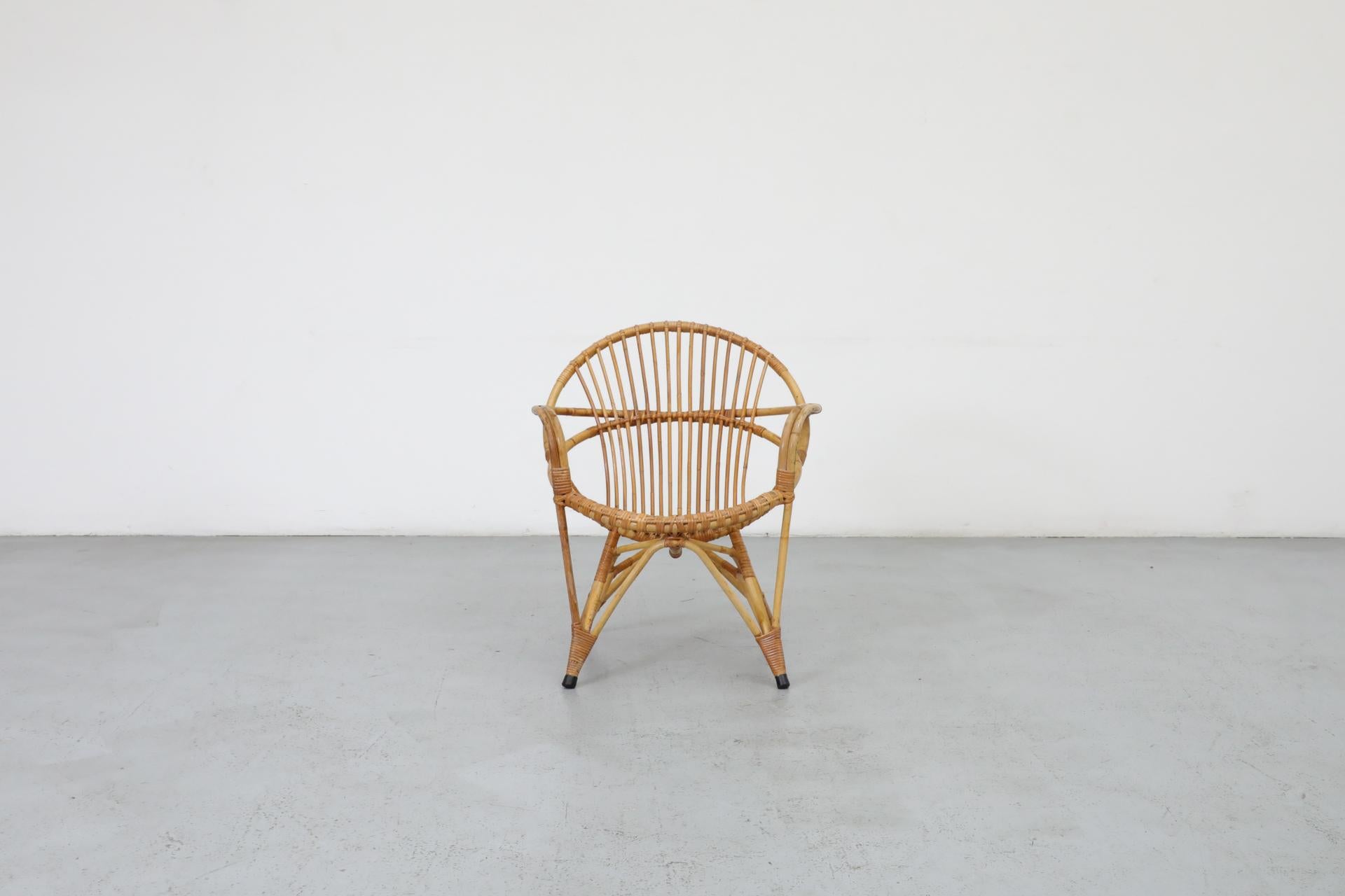 Little Mid-Century bamboo hoop chair by Rohe Noordwolde with black enameled metal frame and white foot caps. In very original condition with visible wear and some breakage consistent with its age and use. Suitable for outdoor use with proper care