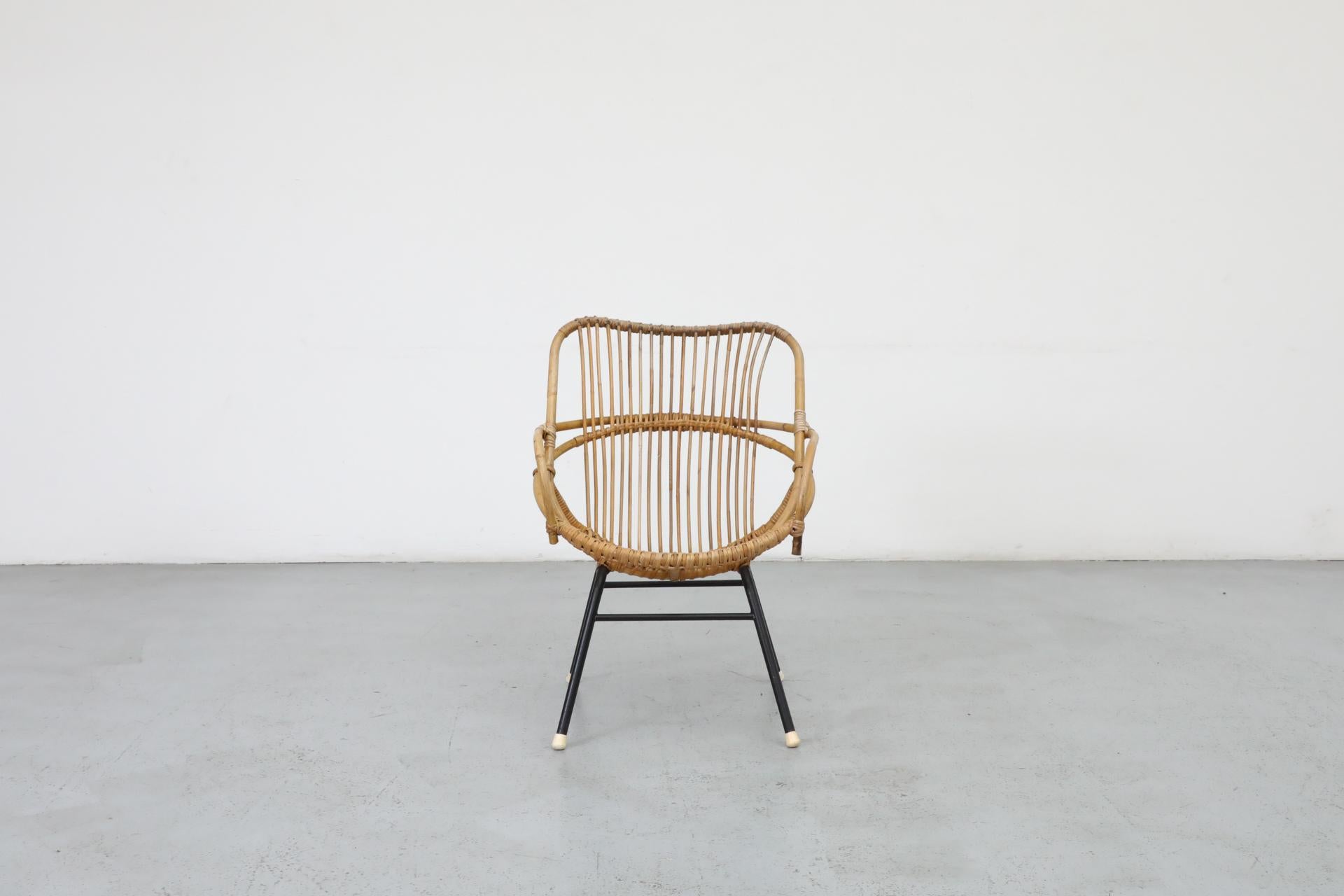 Little Mid-Century bamboo hoop chair by Rohe Noordwolde with black enameled metal frame and white foot caps. In very original condition with visible wear and some breakage consistent with its age and use. Suitable for outdoor use with proper care