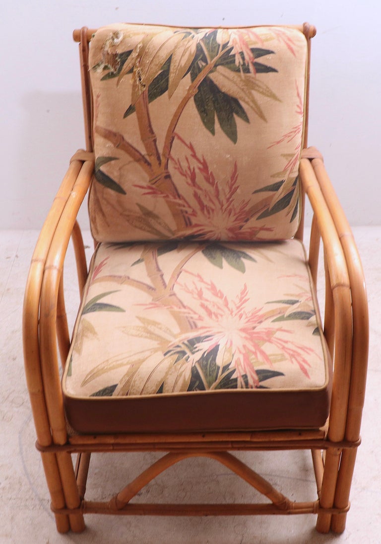 Stylish and chic bamboo lounge chair by the noted maker Superior Reed and Rattan Company. The chair is structurally sound and sturdy, it has the original seat and back cushions, however they are worn, please see images. 
 Total H 32.5 x arm H 24 x