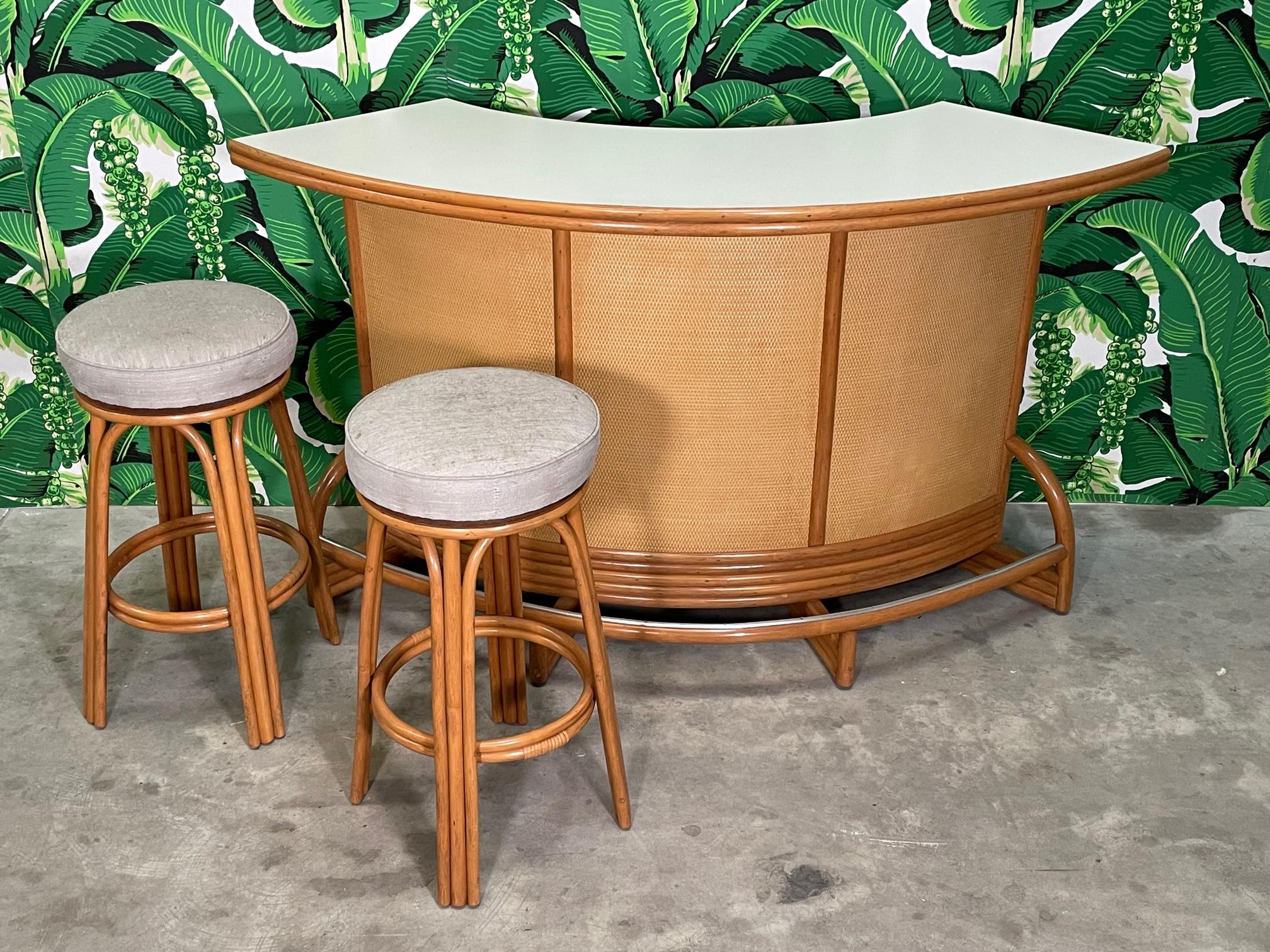 Vintage bamboo/rattan dry bar features a full quarter round design perfect for a corner of a room. Plenty of storage underneath. Good condition with very minor imperfections consistent with age (see photos).