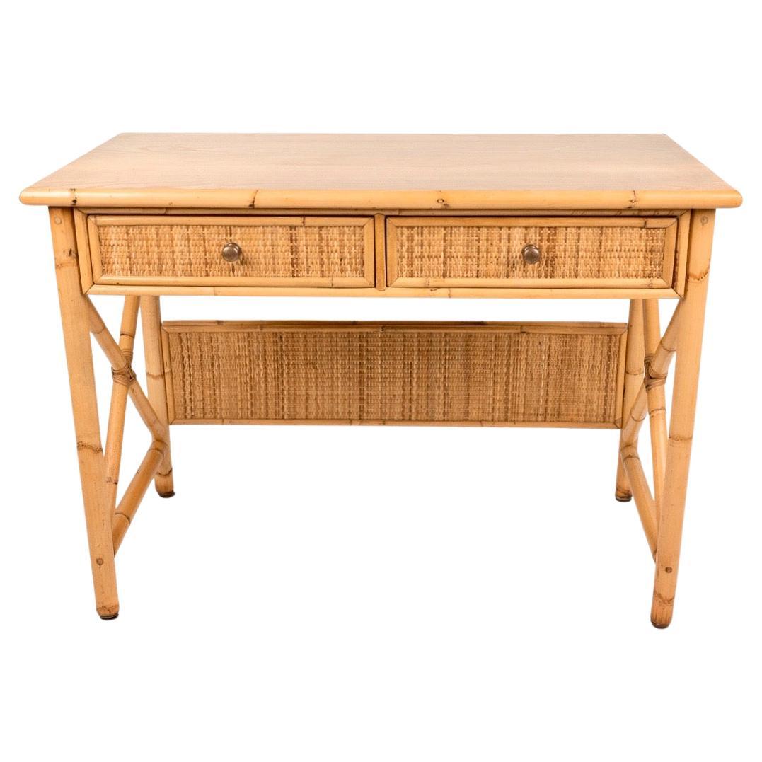 Amazing writing table / desk in rattan, bamboo and wood top, featuring two drawers.

Made in Italy in the 1980s.