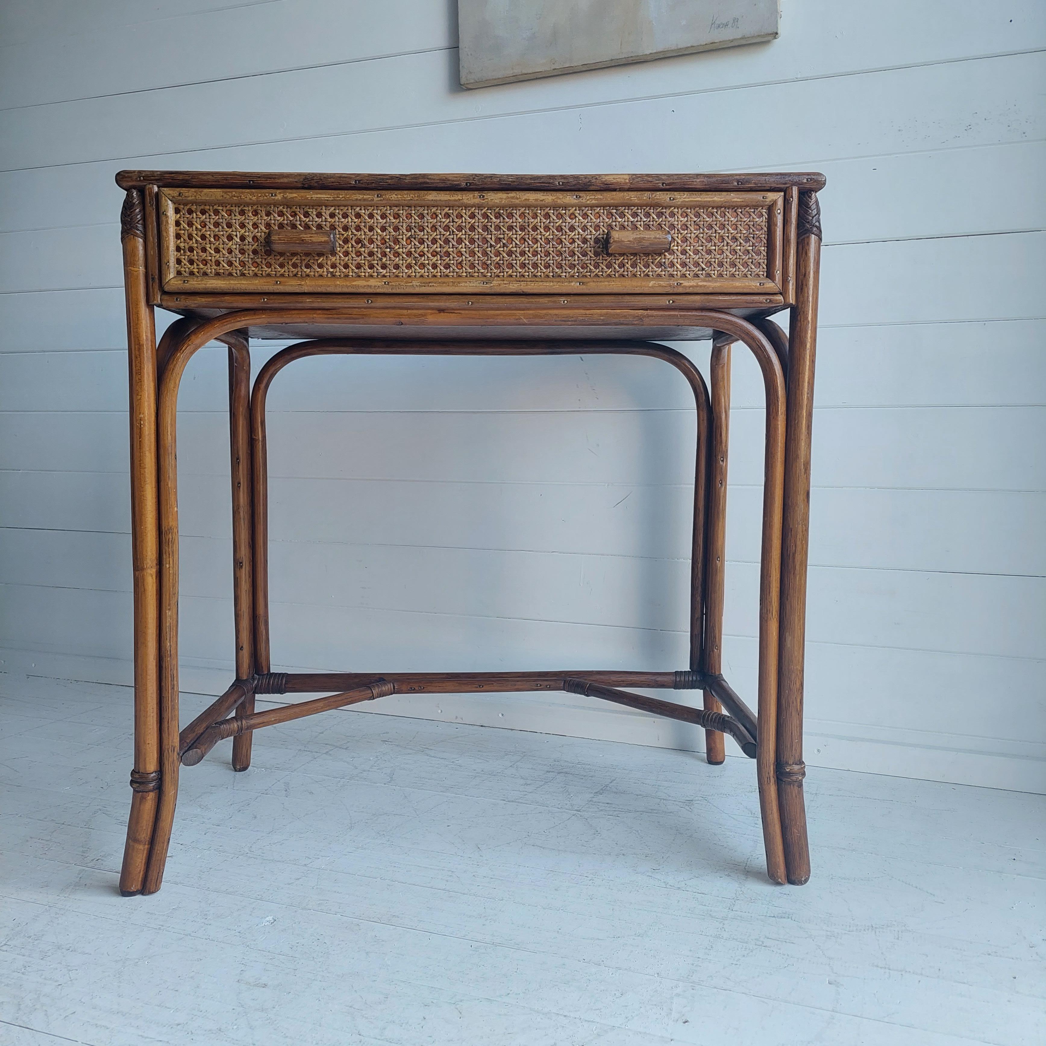 Vintage Angraves Bamboo Rattan Dressing Table 
Beautiful vintage dressing table by the renowned Angraves of Leicester
It could also be used as a desk or make a lovely console table.

Rattan Cane bamboo glass topped dresser/vanity circa 1970s. 

An