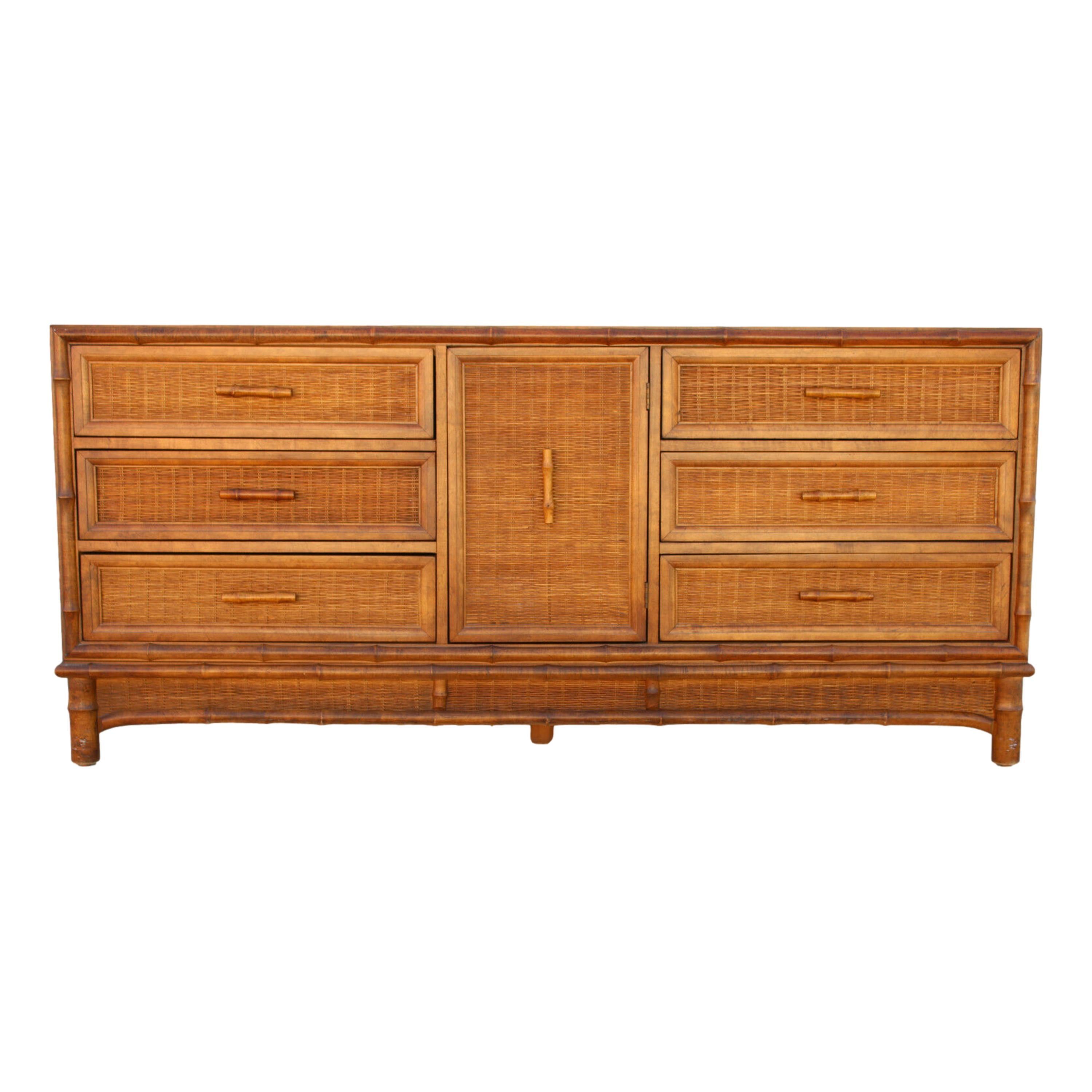 A timeless beauty from American of Martinsville with handsome faux bamboo styling, woven drawer fronts, and faux bamboo pulls in the same color for understated appeal. A center door reveals three hidden drawers. Equally at home in the bedroom, the
