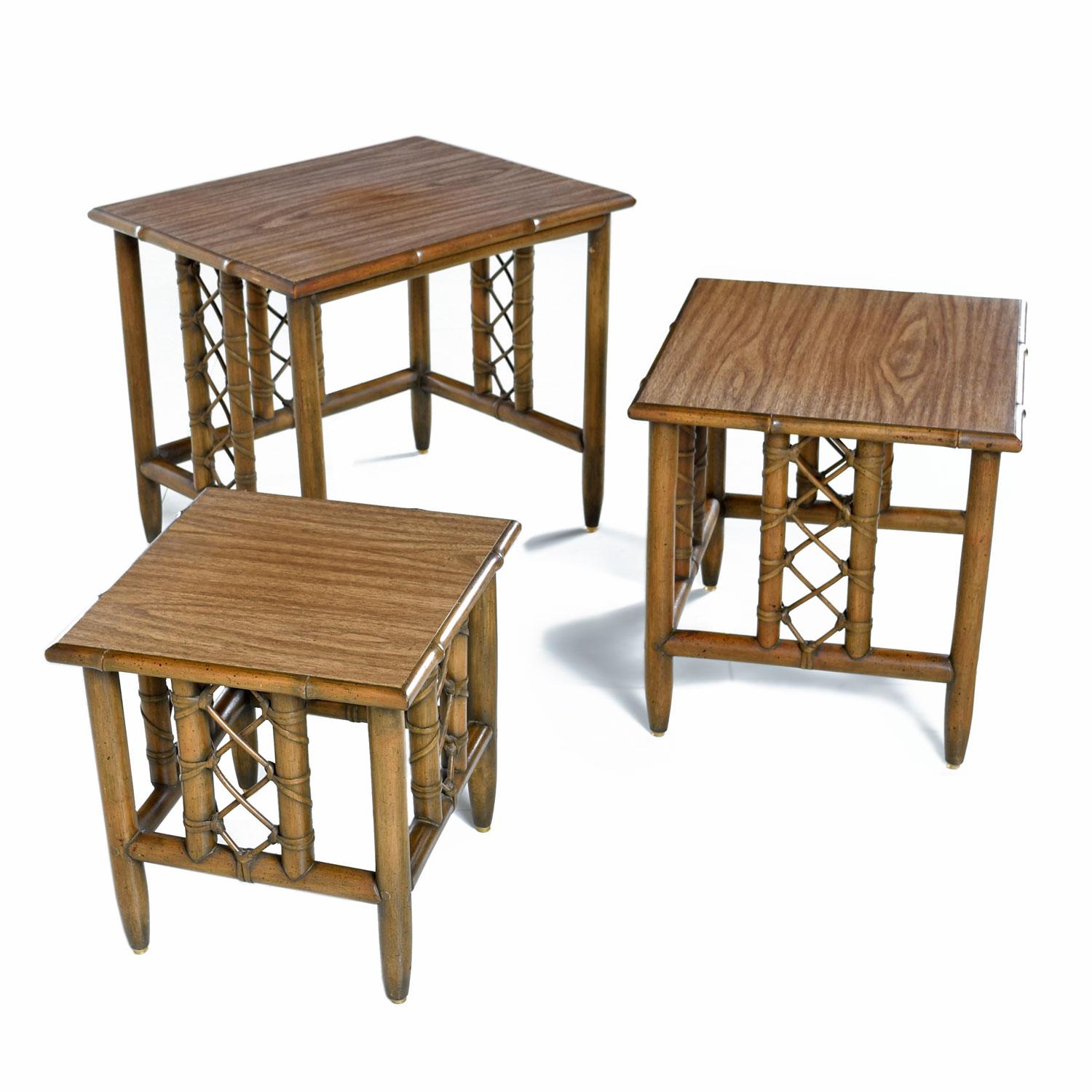 Set of three midcentury bamboo rattan nesting tables of ascending size. Durable faux wood laminate tops with durable construction. Cleaned, detailed and oiled top to bottom.
  