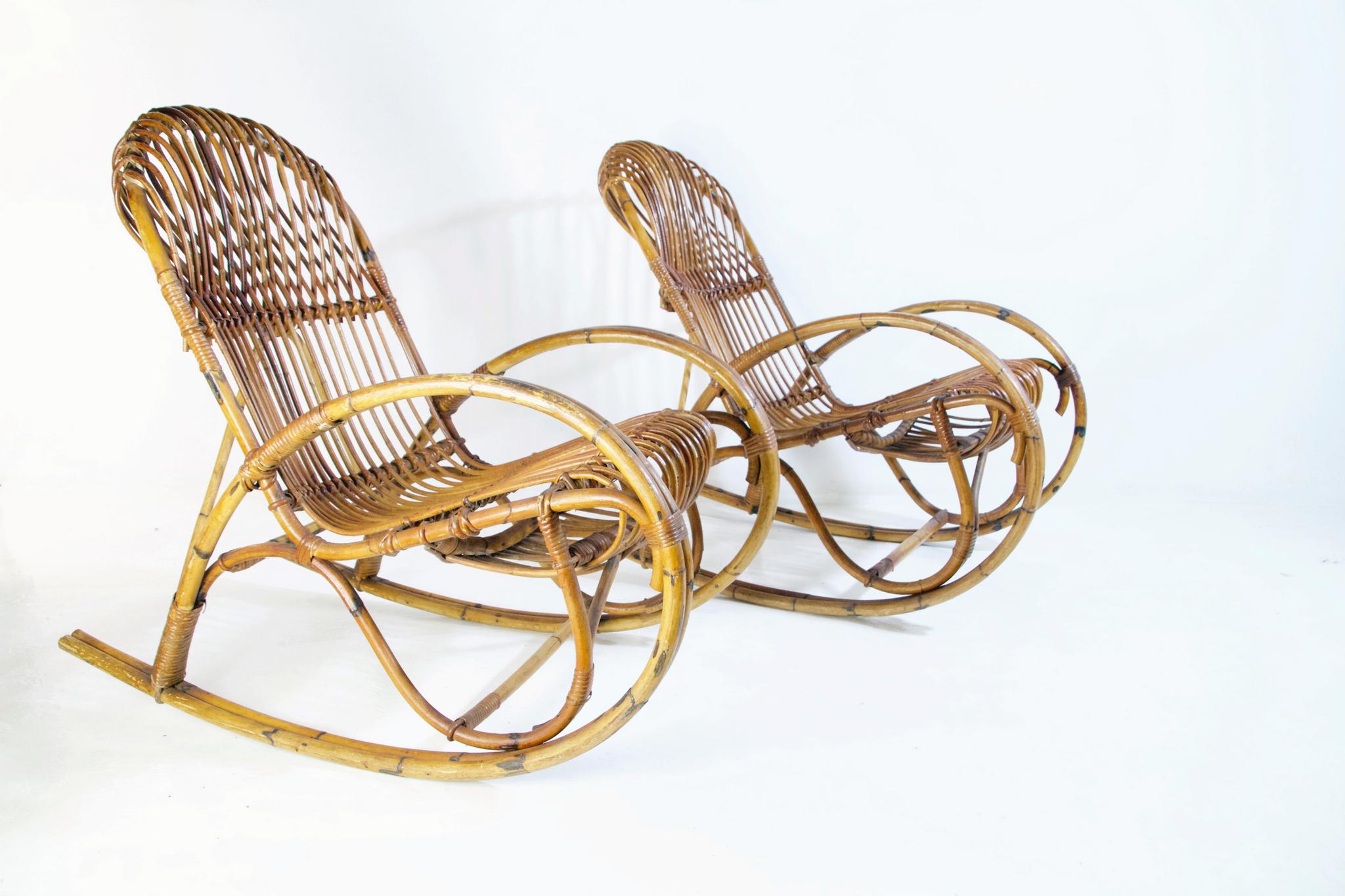 A pair of elegant and comfortable pair of rocking chairs in the style of Franco Albini Italy. The chairs are in very good condition and functions well.