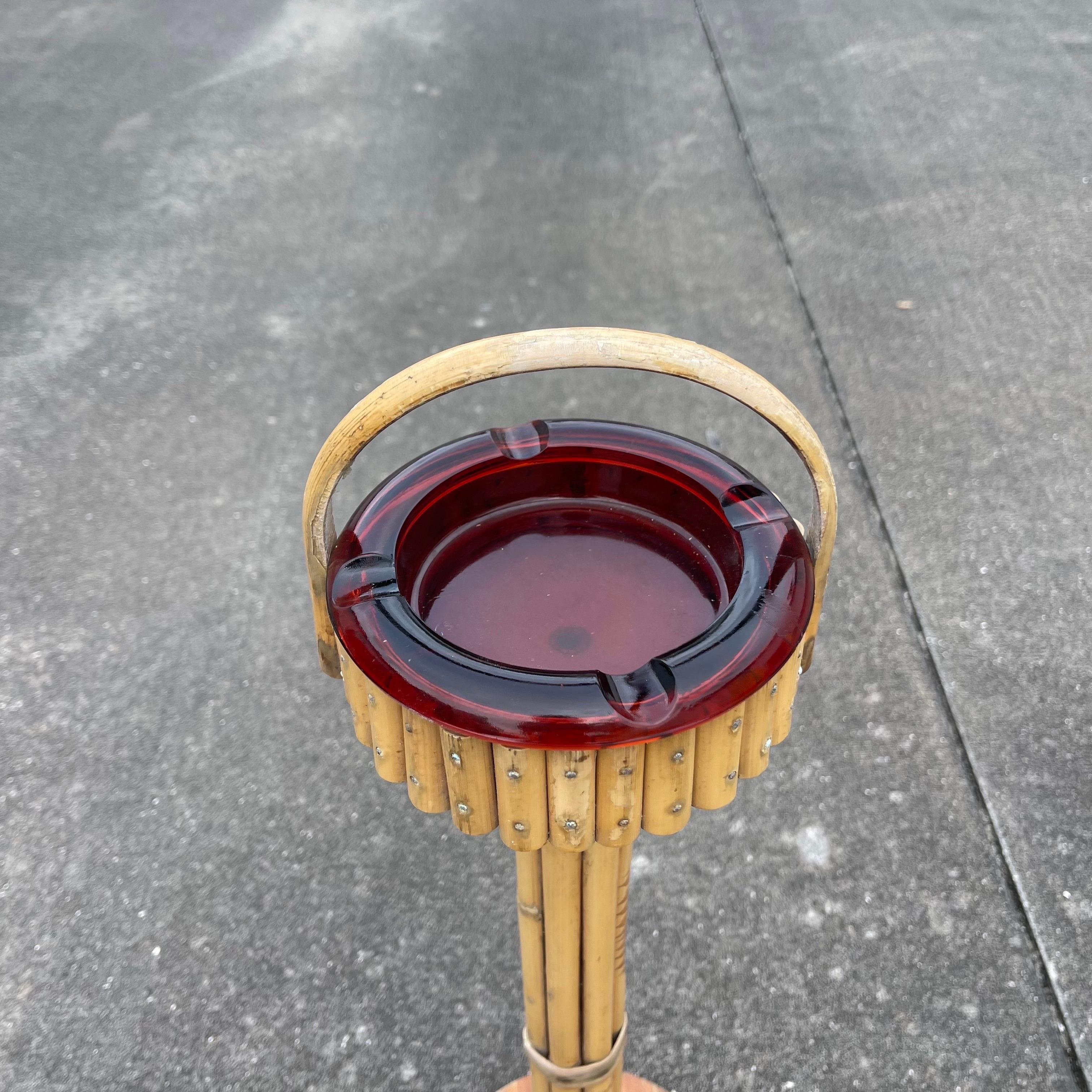 Charming mid-century bamboo ashtray stand with removable red glass ashtray.