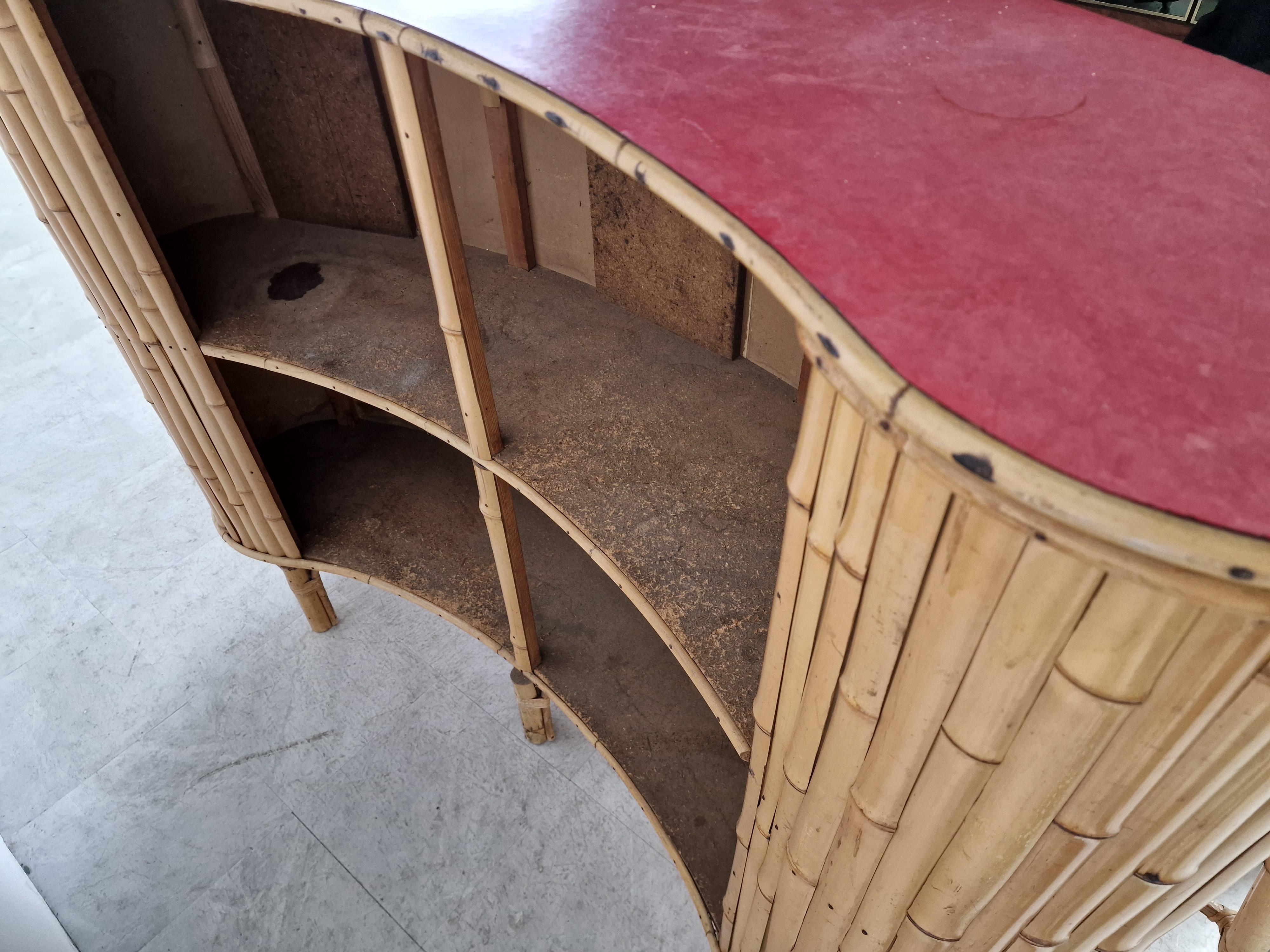Lovely Tiki bar in bamboo for sale with a red formica table top and 4 matching stools. 

The bar also has ceramic tiles at the front.

Beautiful and well made example.

Very good condition.

1960s - France

Dimensions:
Height: