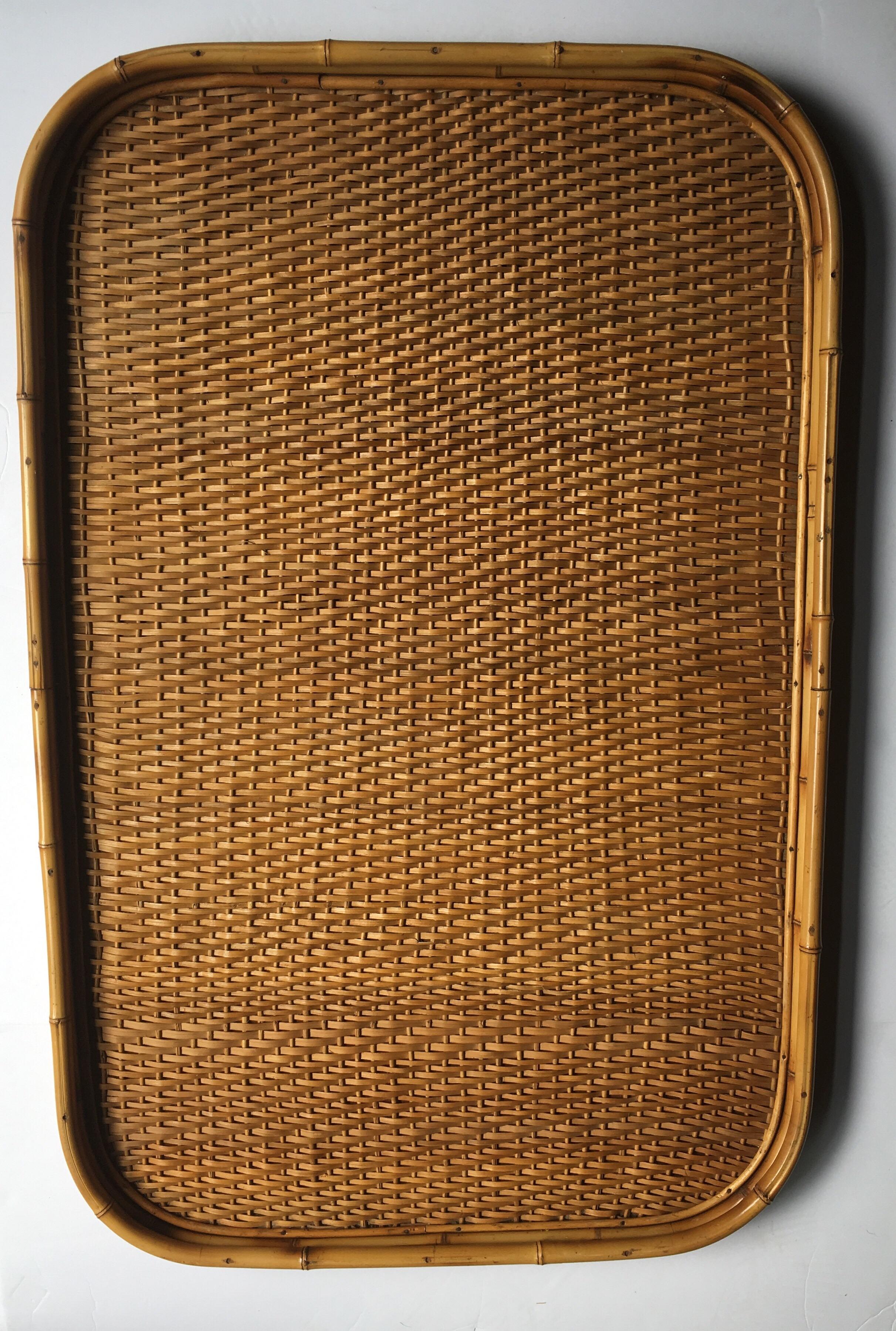 Impressive oversized rectangular woven rattan wicker bamboo tray with removable clear glass insert. This beautiful handcrafted serving tray can be displayed on an ottoman or dining sideboard as a bar service station.