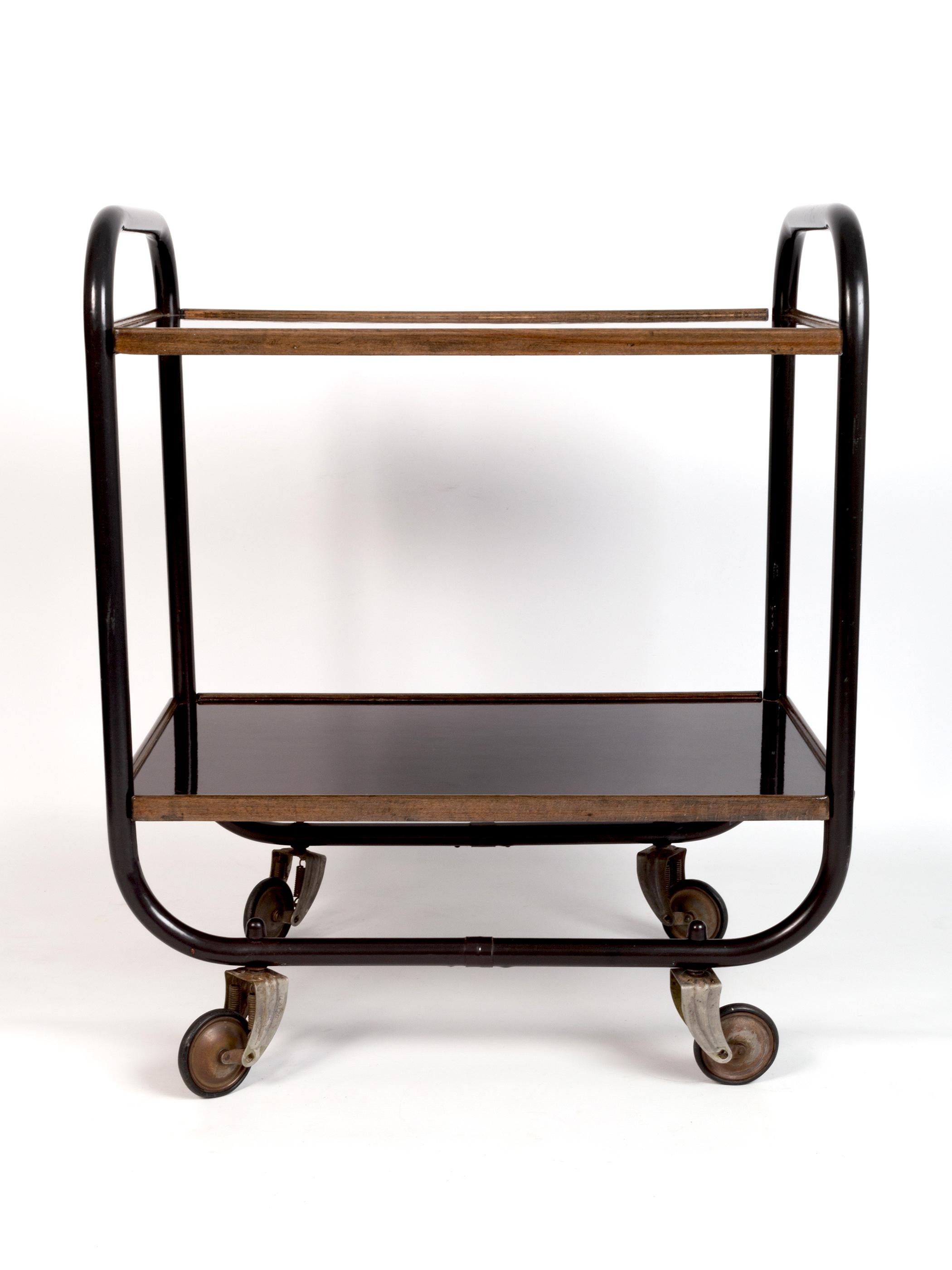 A mid century bar cart, England C.1950.

Designed by Frank Guille for Kandya. A stylish piece constructed from tubular steel with lacquered bakelite trays.

Kandya was at the forefront of British furniture manufacturing in the mid 20th century.