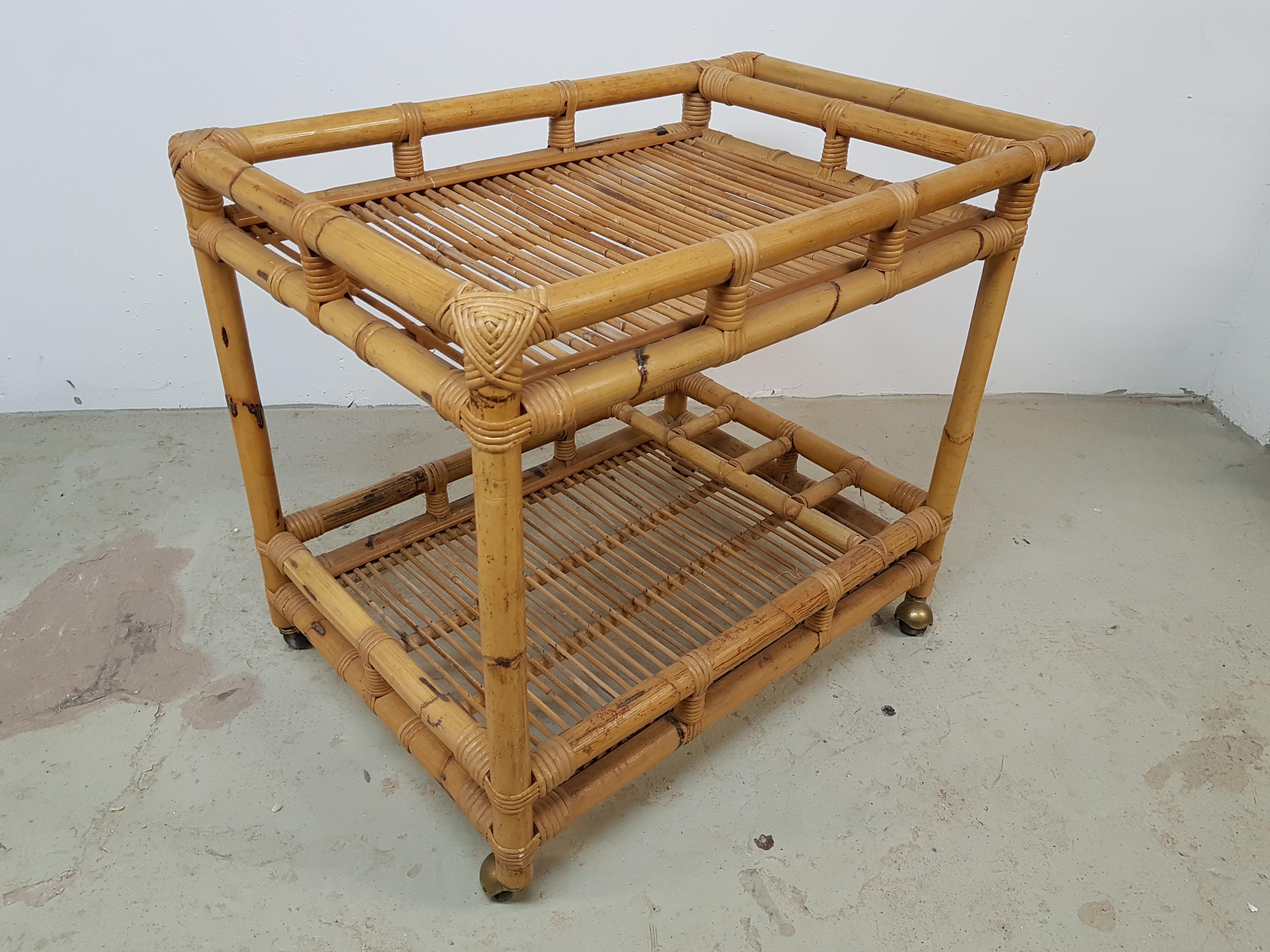 Midcentury bar cart rattan bamboo, France, 1960. Perfect vintage condition. Brass covered castors.