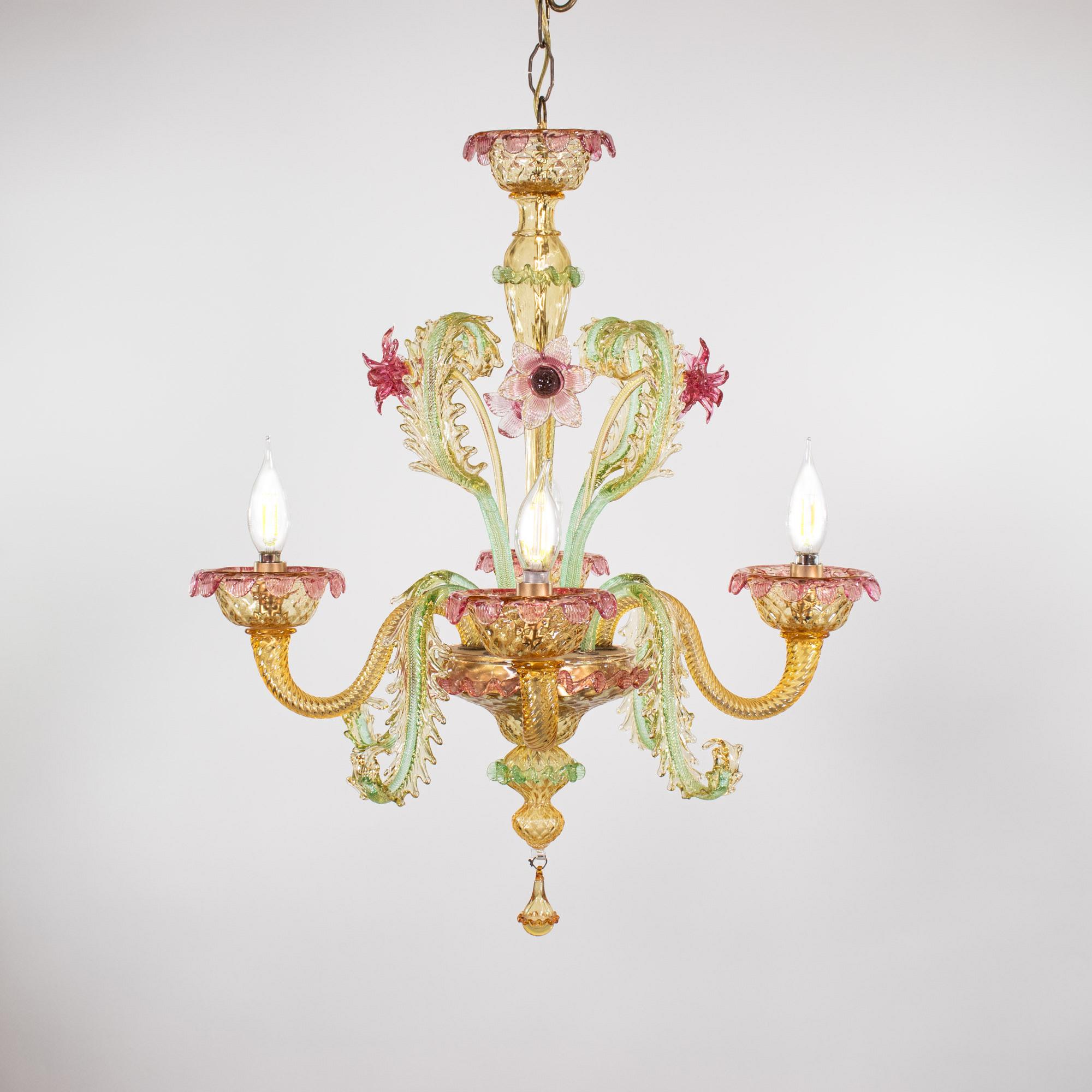 This exquisite Mid-Century Baroque Style colorful Murano glass chandelier features four gracefully undulating arms adorned with petal-trimmed round bobeches. The chandelier is a richly decorated bouquet of assorted flowers. Two flowers resemble