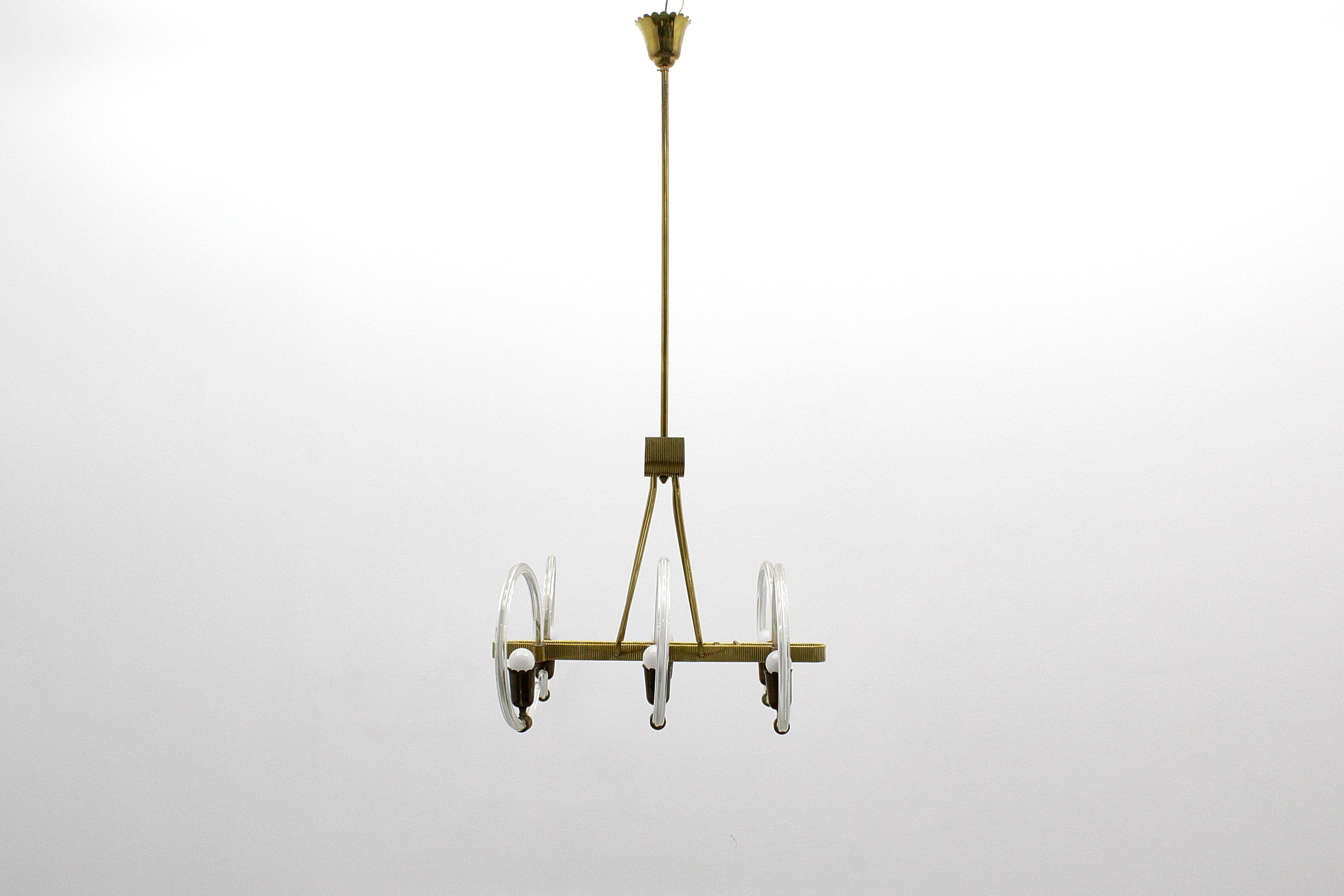 Beautiful and refined Murano glass chandelier with six circular glass arms and brass lamp holders. Gilded brass frame and finishes. Attributed to Barovier & Toso, a Venetian manufacturer from the 1940s.
Where consistent with age and use.