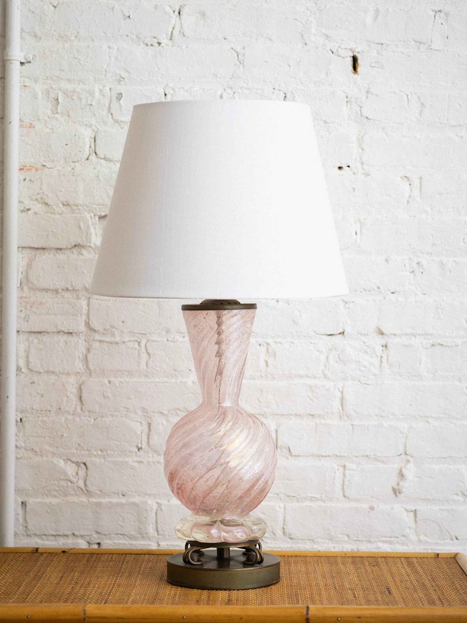 Midcentury Barovier Toso Murano glass lamp. Glittery pale pink translucent glass and antiqued brass hardware. Lamp shade not included. Harp adds an additional 7” to height.