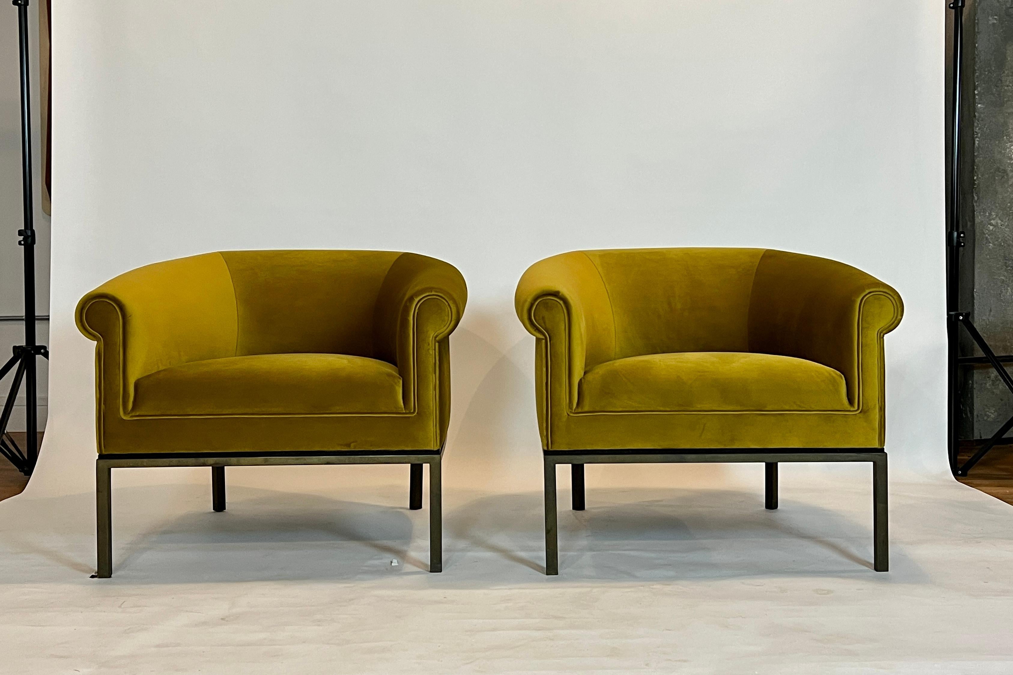 Stunning pair of mid-century Metropolitan barrel chairs on bronzed metal frame and newly upholstered in 