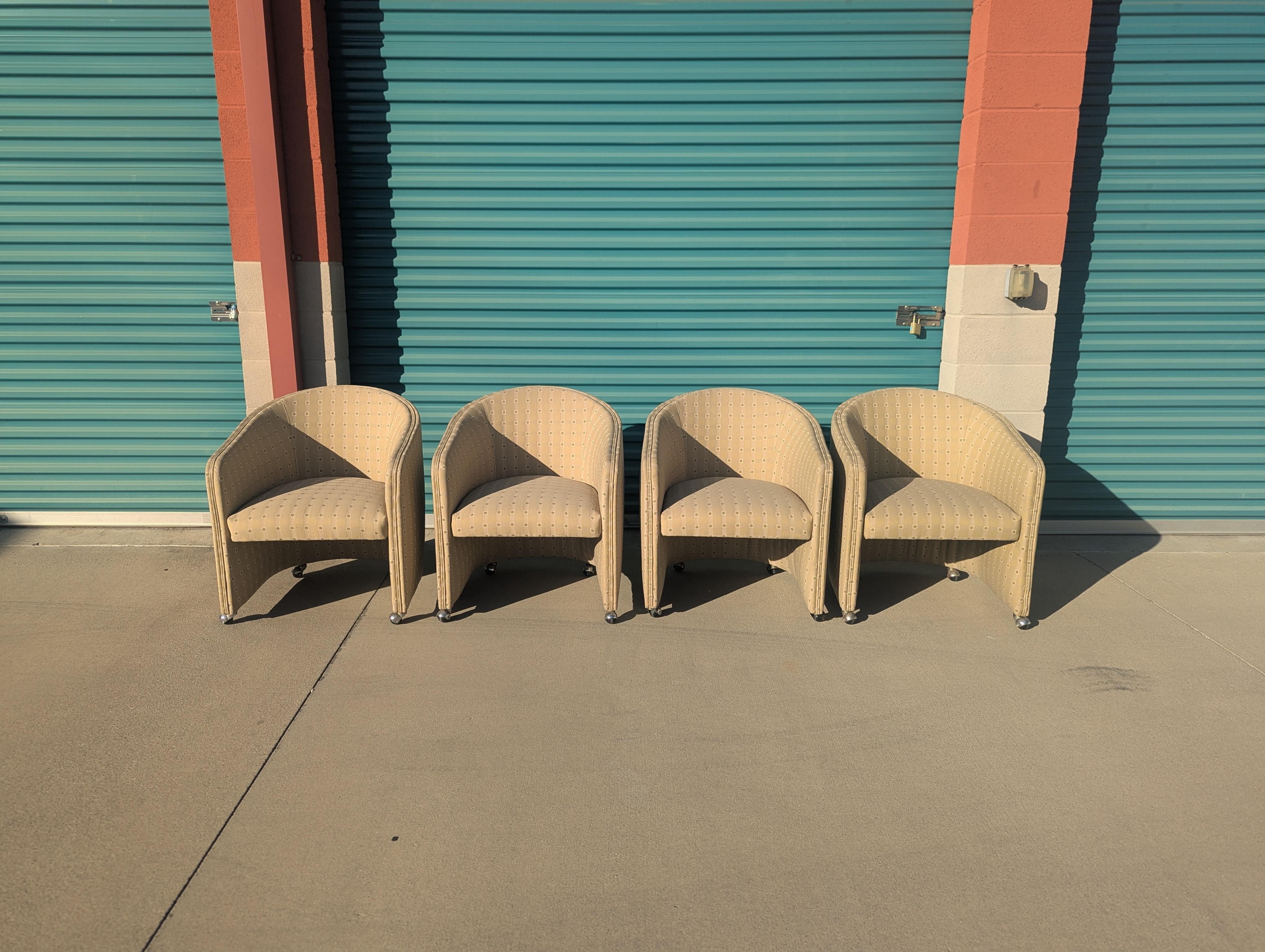 Bring vintage flair and versatile comfort to your home with this exceptional set of four Vintage Mid Century Barrel Chairs on Casters, circa 1970s. Each chair is upholstered in eye-catching patterned fabric that channels the spirited style of the
