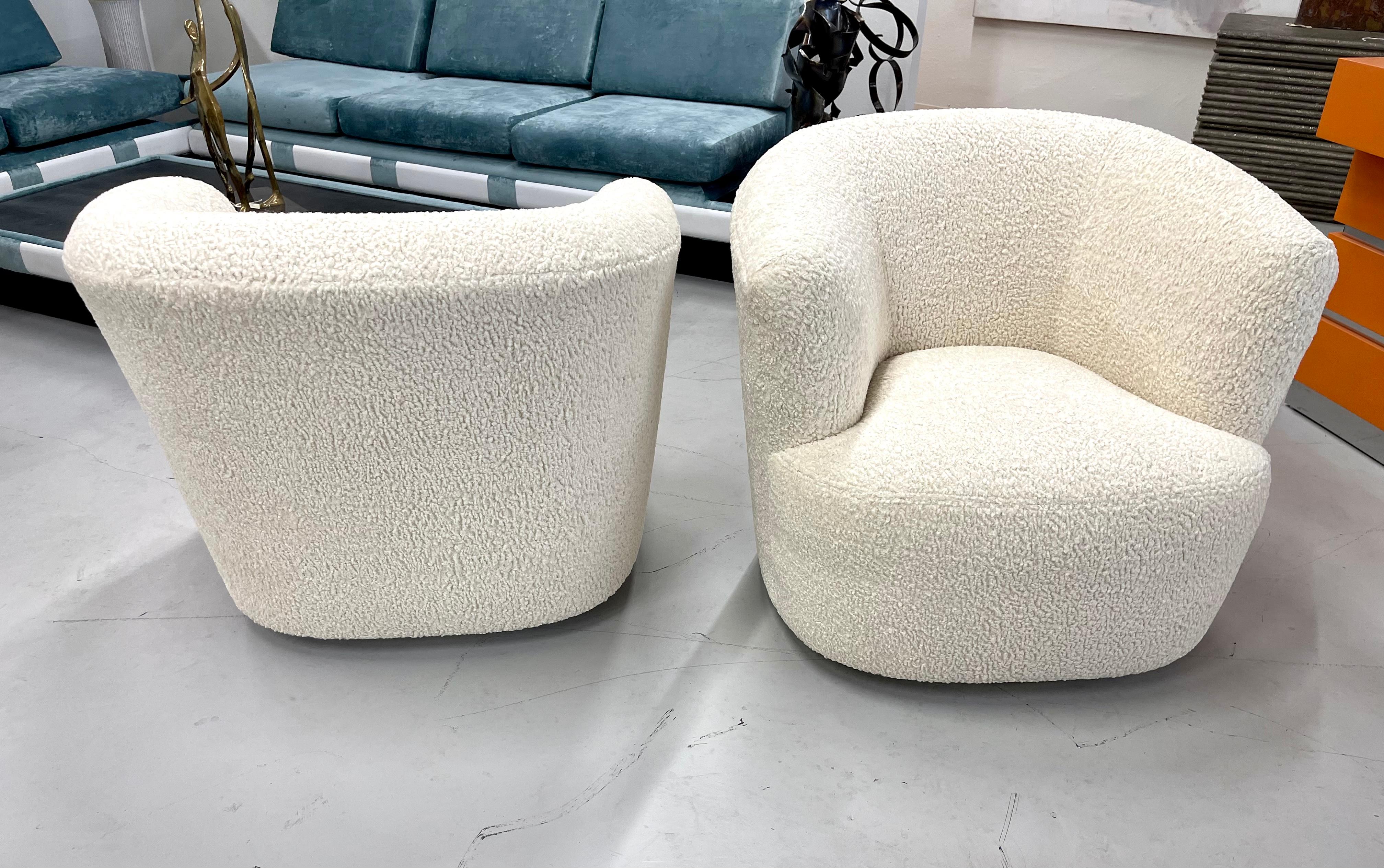 A Beautiful pair of barrel swivel chairs re-upholstered in an Italian faux Sheepskin fabric. The fabric is a Polyester blend. On fabric covered bases. Great form and style. Pictured in our gallery next to a Vladimir Kagan 7 foot sofa and a Laverne