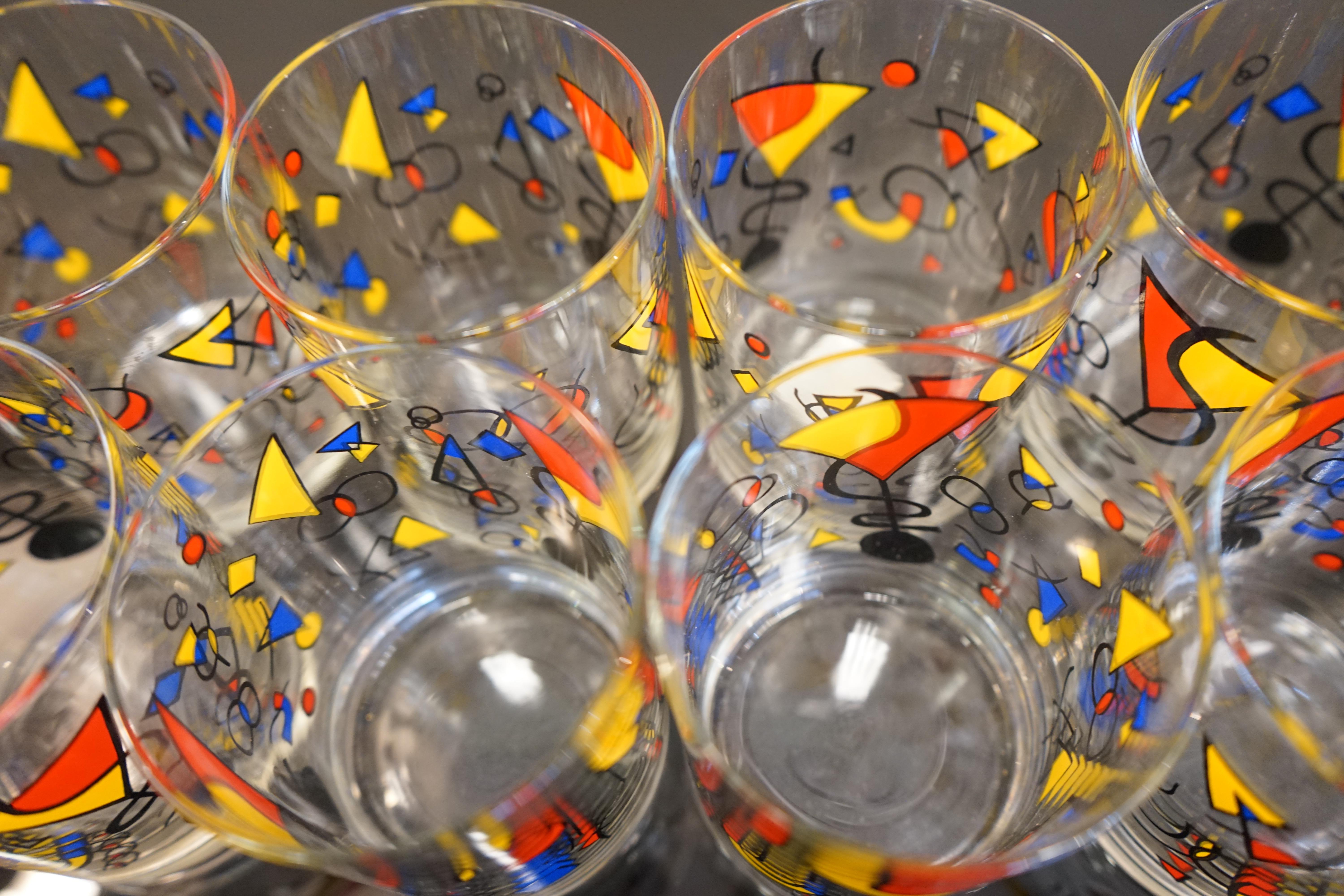 Mid-Century glass barware set featuring eight multi-color 