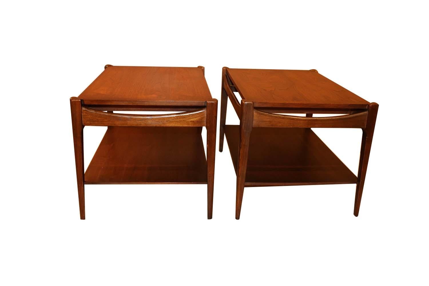 Pair of beautiful retro 1960s Danish style end side tables, impressive and sleek Mid-Century Modern “Artisan Collection” line tables by Bassett. The lines are clean and elegant. Tables are made of walnut. Finely tapered pencil legs hint to a