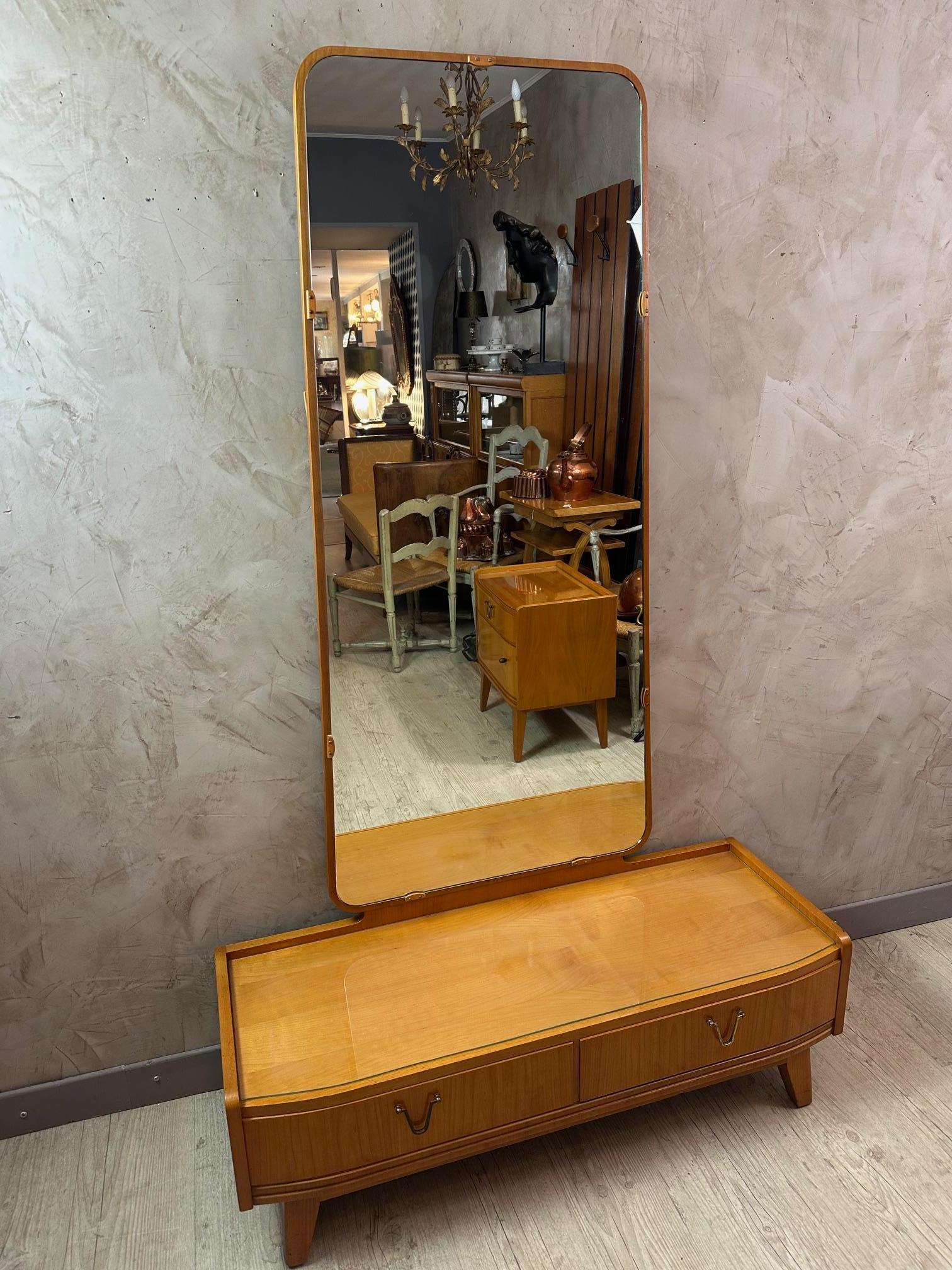 Beautiful 1950s Bauhaus-style ash veneer dressing table in excellent condition.
Two drawers with beautiful metal handles. A removable custom-made glass top.
Removable mirror held in place by the wood that attaches to the bottom.
Superb quality.