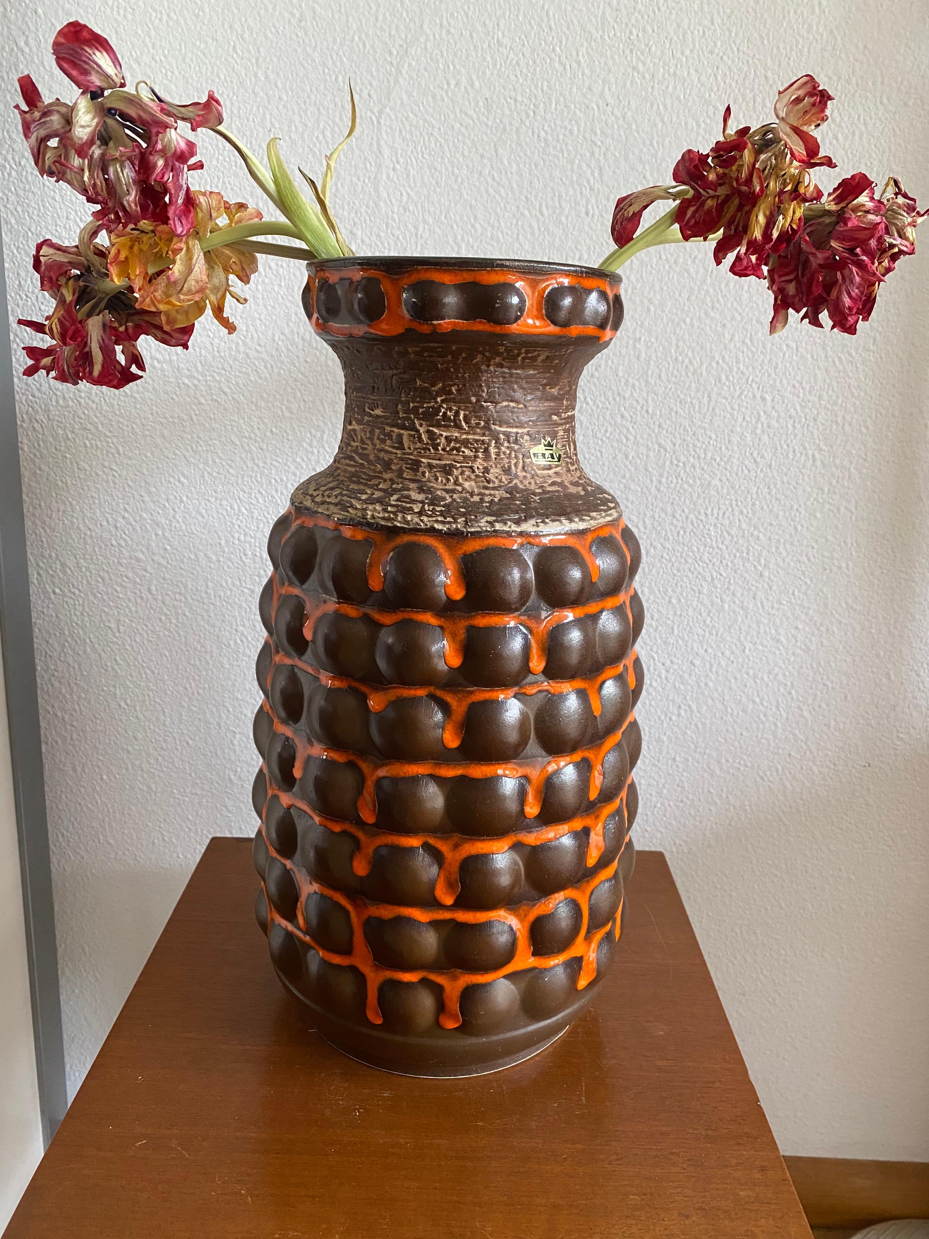 Vibrant Orange and Brown Seventies tall Bay vase, quite rare decor and to my opinion the most attractive vase from this period. Original label. 
I have a similar one for sale in another color scheme. 
Designer: Bodo Mans was employed by the Bay