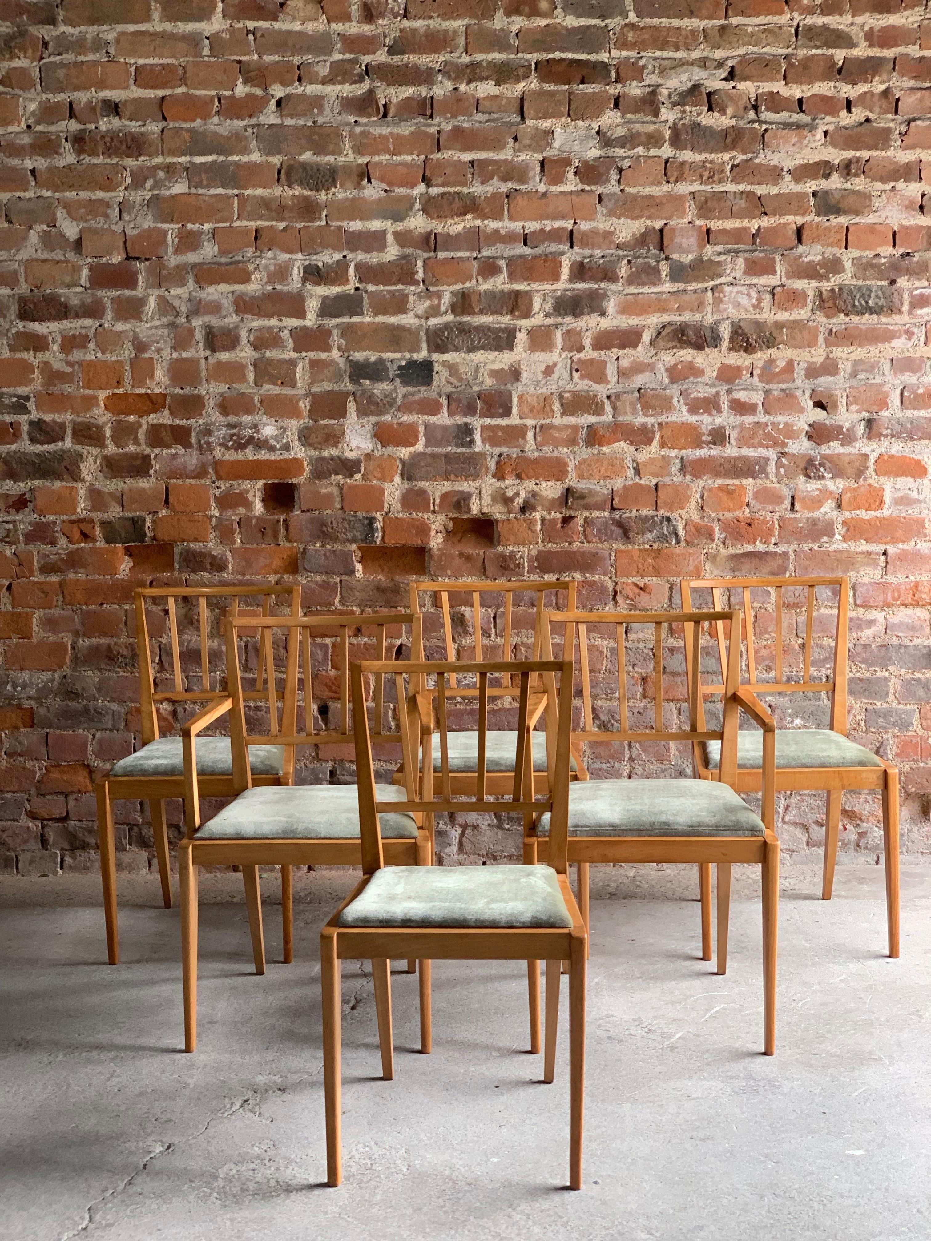 Fabulous midcentury Danish style BCM ( Bath Cabinet Makers) extending teak dining table with six matching teak dining chairs, circa 1970, The table with a butterfly action centre leaf that folds out when extended and folds back under when closed,