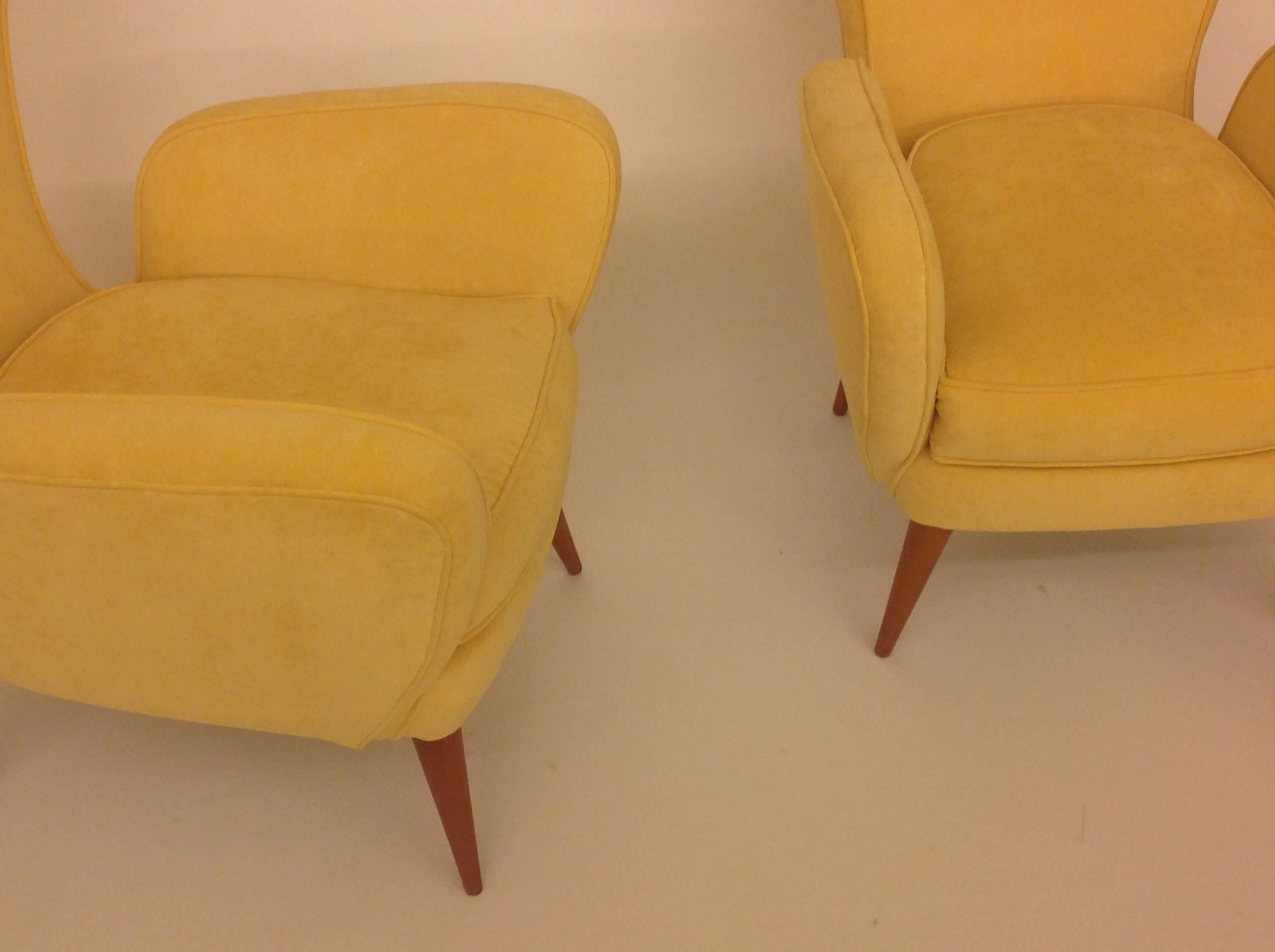 A beautiful and perfect pair of 1950 circa Italian armchairs in wood with yellow velvet cover. Production Italy.