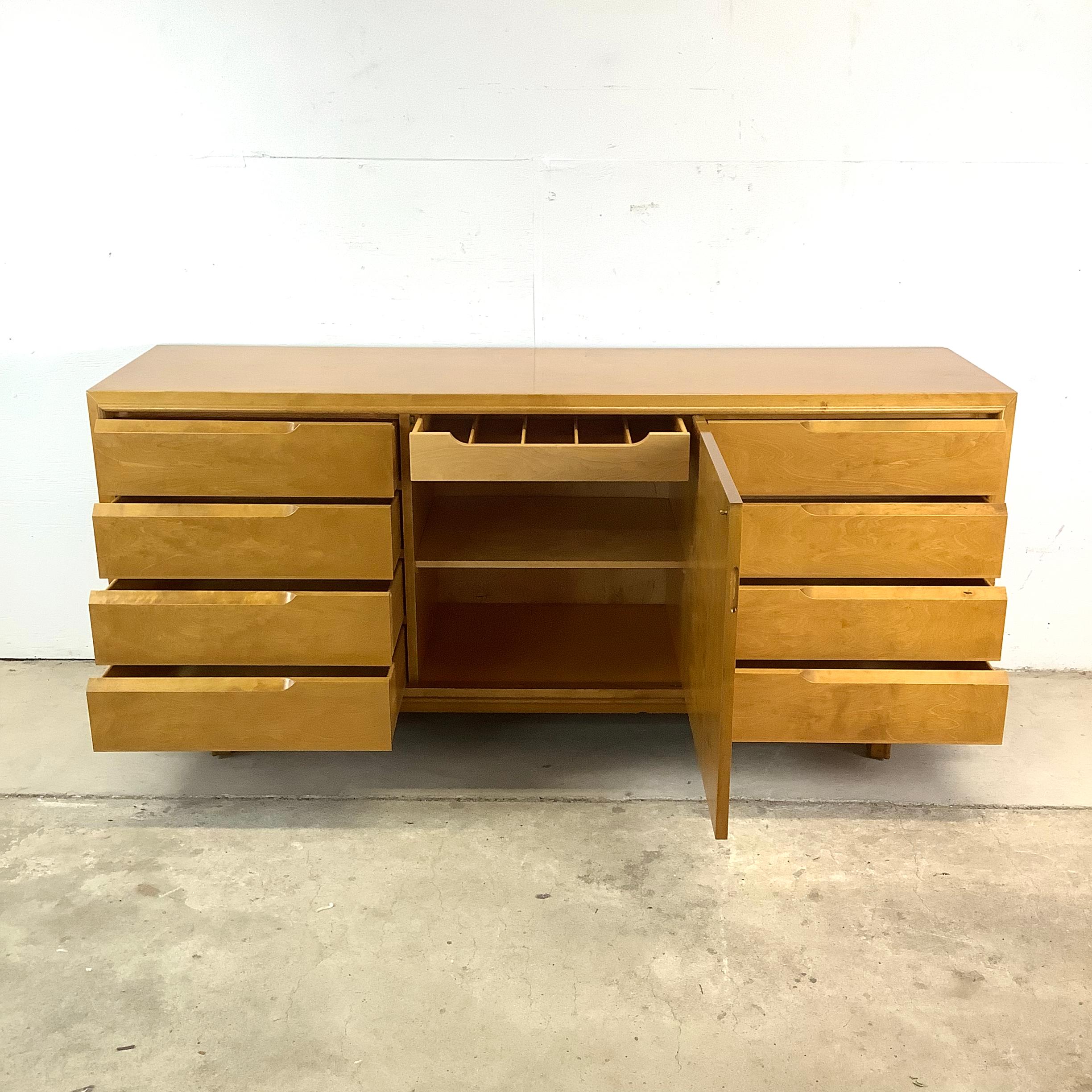 Elegance, craftsmanship, and Scandinavian modernism come together in this striking Edmond Spence attributed bedroom dresser. Designed with both form and function in mind, this Swedish-made mid-century piece features a stunning birch wood finish that