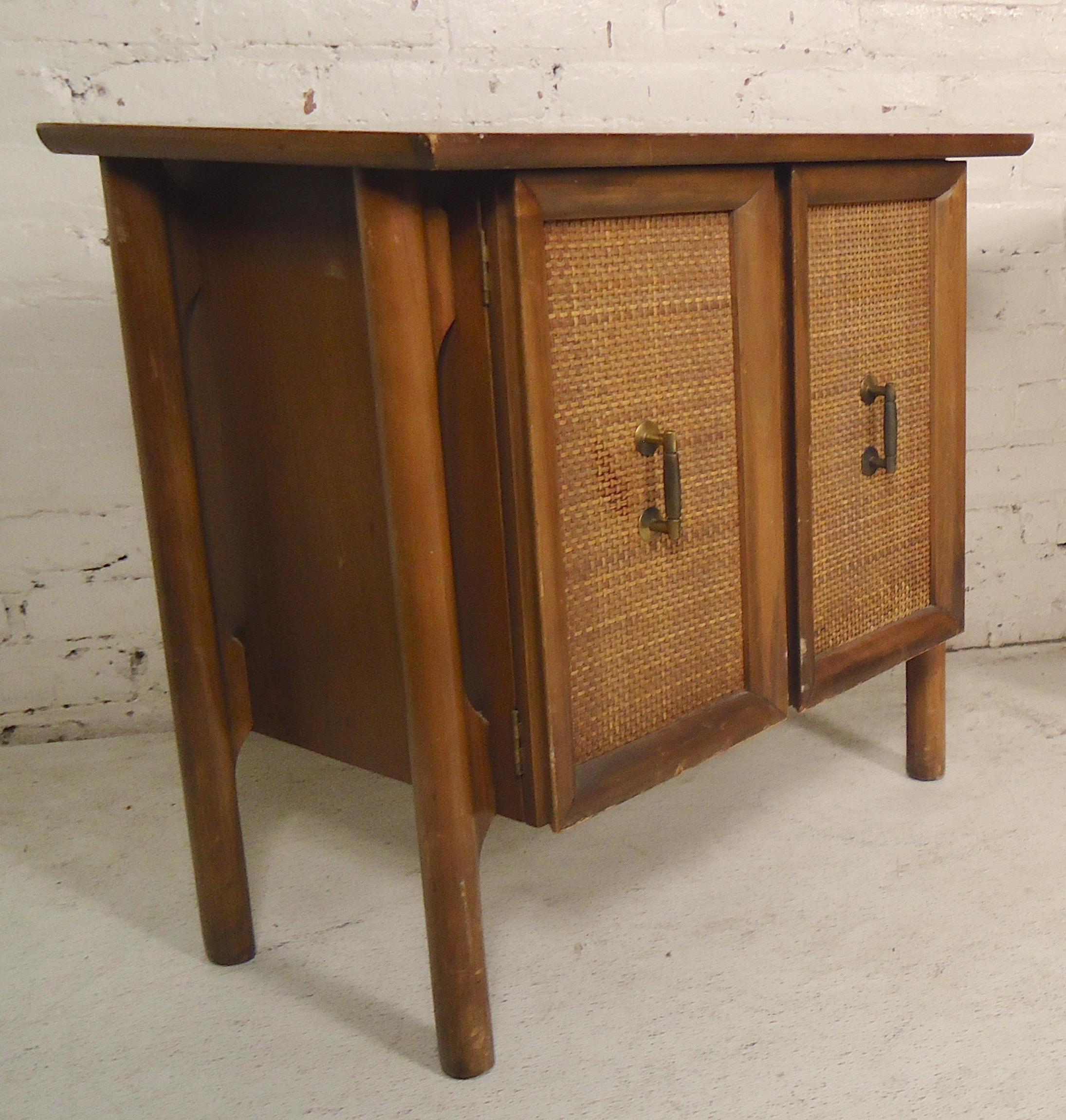 Walnut end tables with wicker front and brass handles. Two door cabinet with shelving holes.

(Please confirm item location - NY or NJ - with dealer).
 