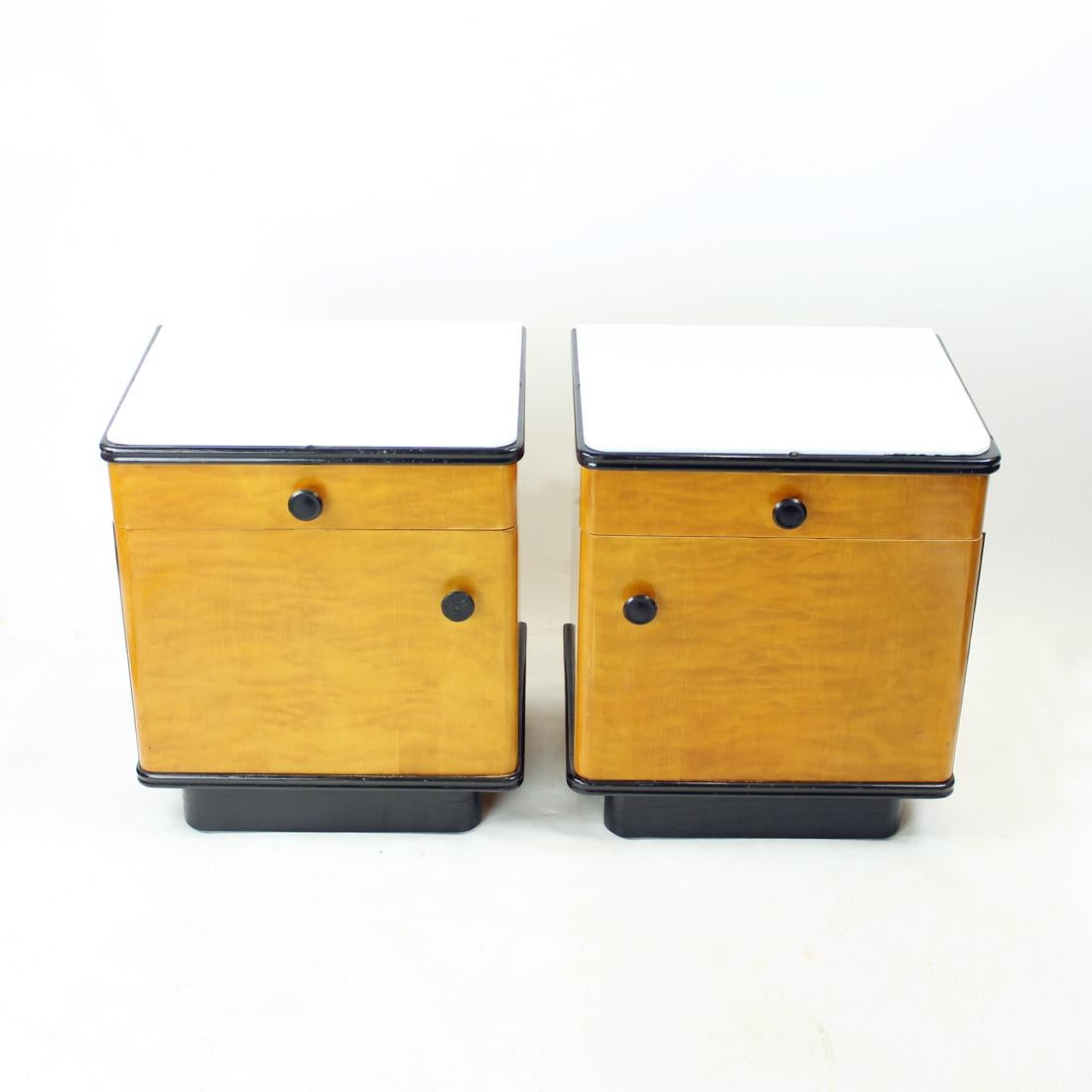 Beautiful set of two bedside tables. Produced in Czechoslovakia by UP Zavody furniture company in 1960s, original stamps of the series still visible on the back. Marked as the Series 7, 635. The tables are of rectangular shape with one drawer and a