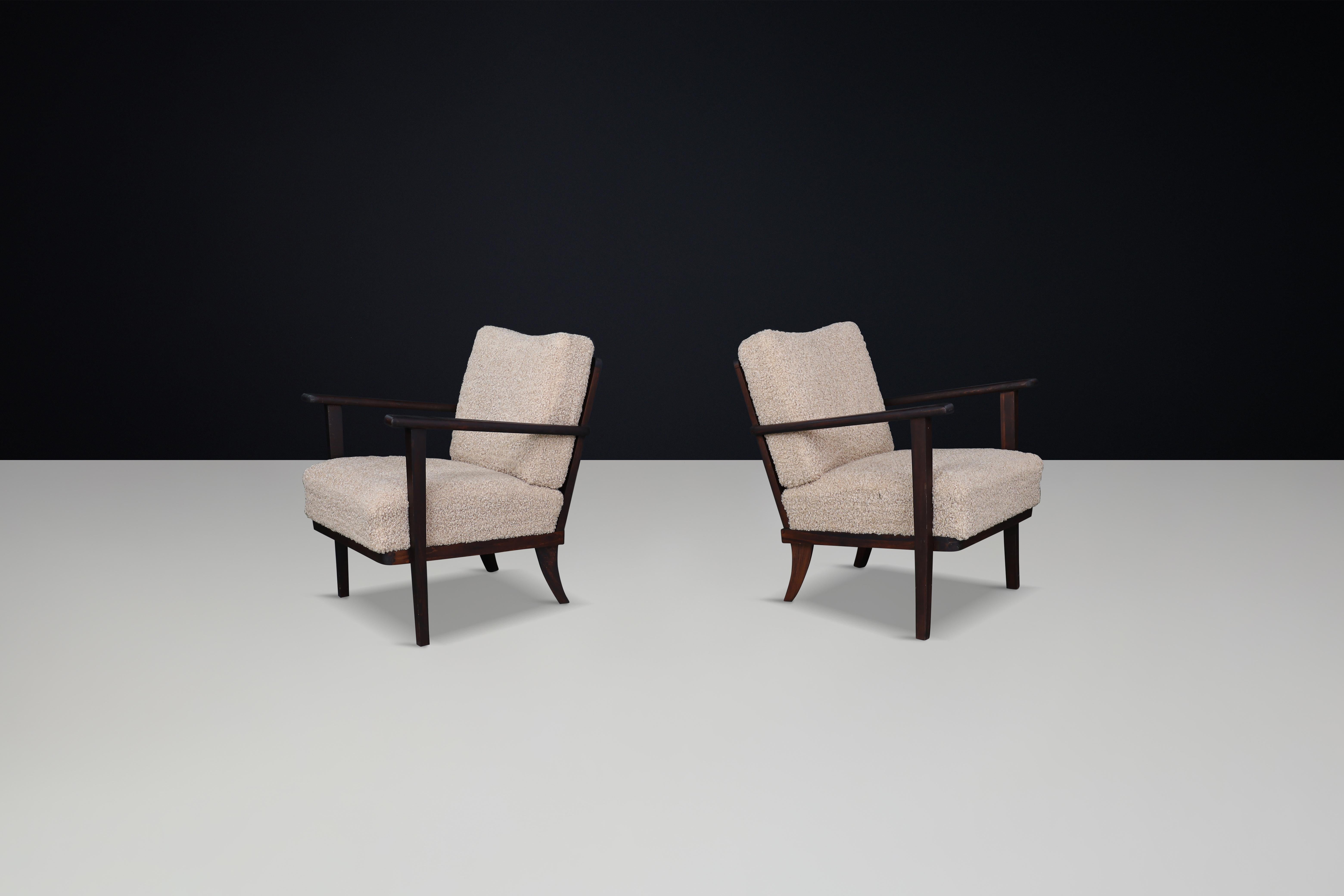 Mid-Century Beech Armchairs in Oak and Teddy Upholstery, France, 1950s  

This description features a pair of original mid-century armchairs designed and manufactured in France during the 1950s. The chairs are made from solid stained beech and have