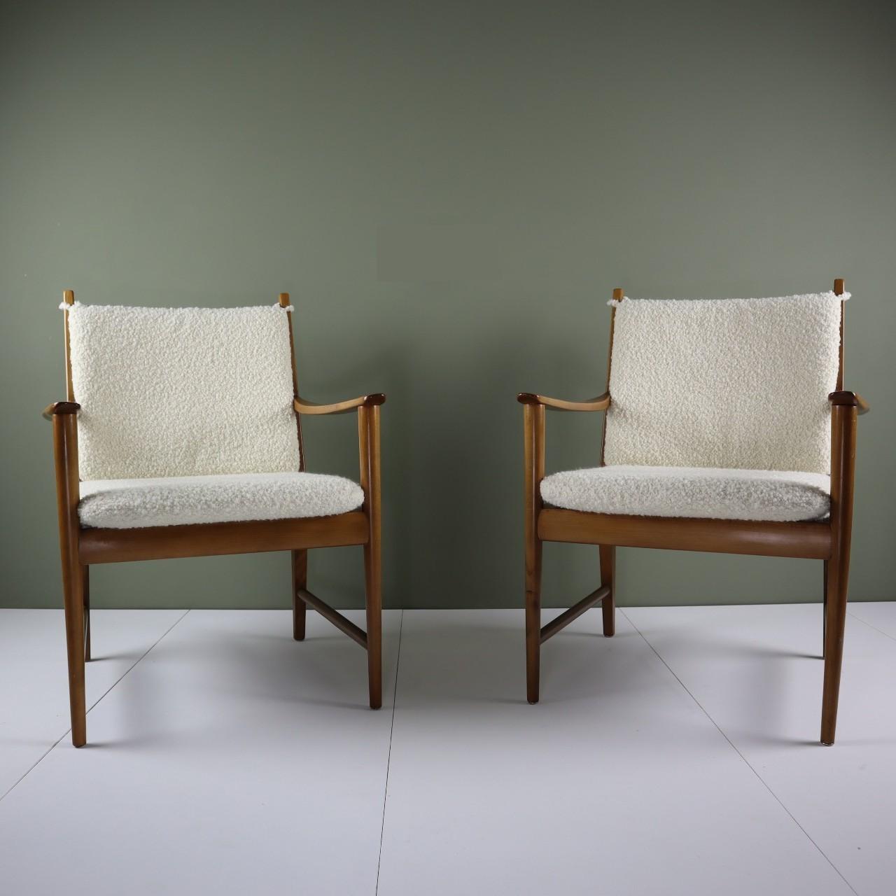 A pair of unusual midcentury armchairs in beech wood, reupholstered with an Italian-made off-white bouclé fabric from Designers Guild’s Lana collection.

These chairs were bought at an auction in June of 2021. The chairs are either Danish or