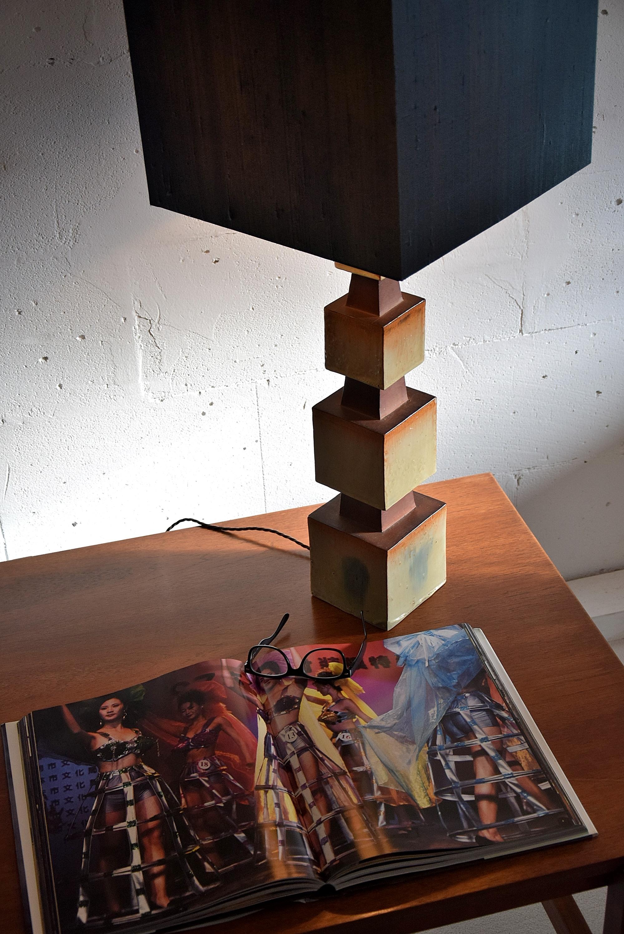 One of a kind midcentury ceramic table lamp with a new silk shade. This beautiful piece is in perfect condition. No cracks or chips.
Measurements: H. 93 x W. 36 x D. 36 cm. Shade height 335 cm. Ceramic base is W. 13.5 x D. 13.5 cm
Lamp will be