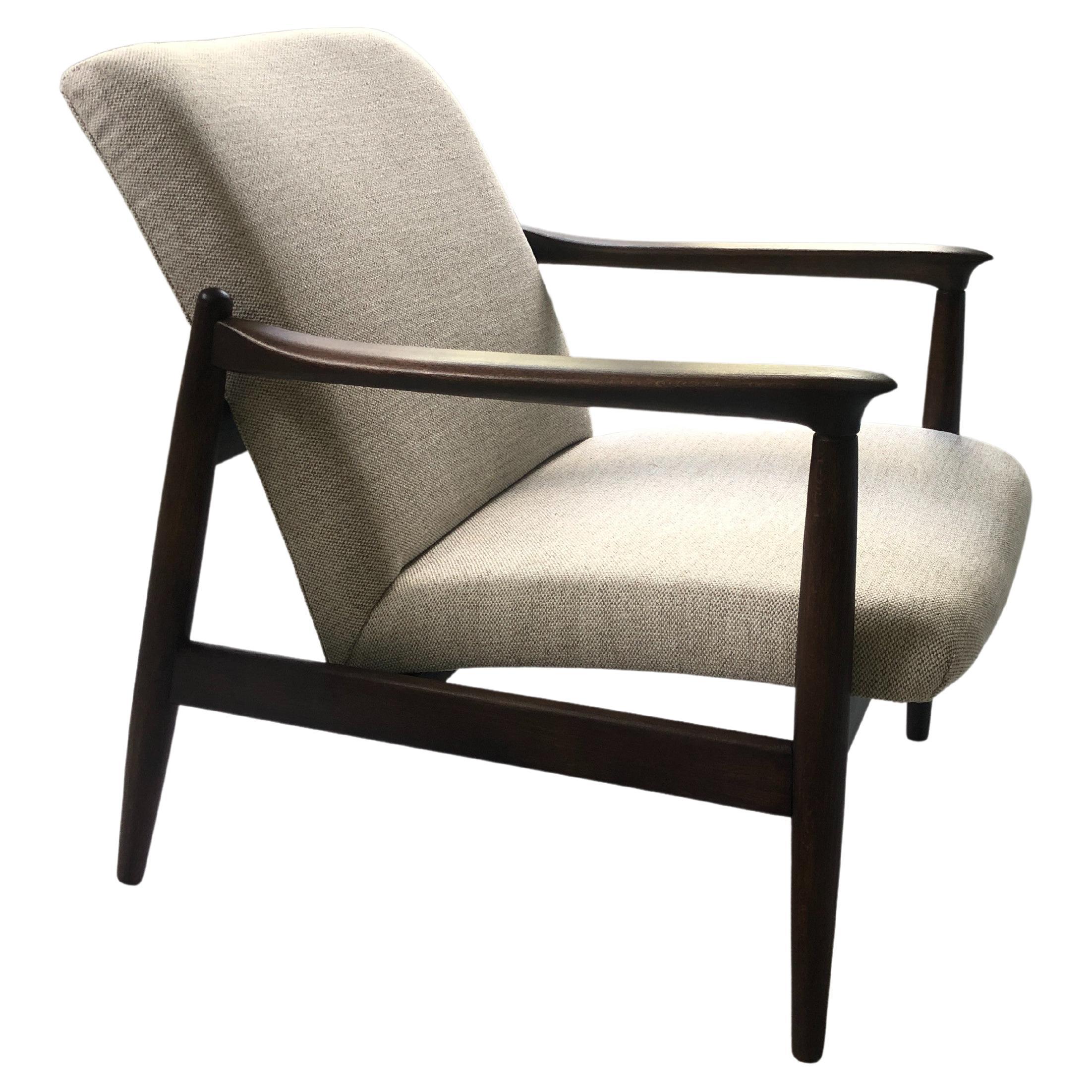One of the icon of Polish mid-century design, GFM-64 armchair, designed by Prof. Edmund Homa - Polish architect, industrial and interior design designer, professor at the Academy of Fine Arts in Gdansk. The armchair has been manufactured by
