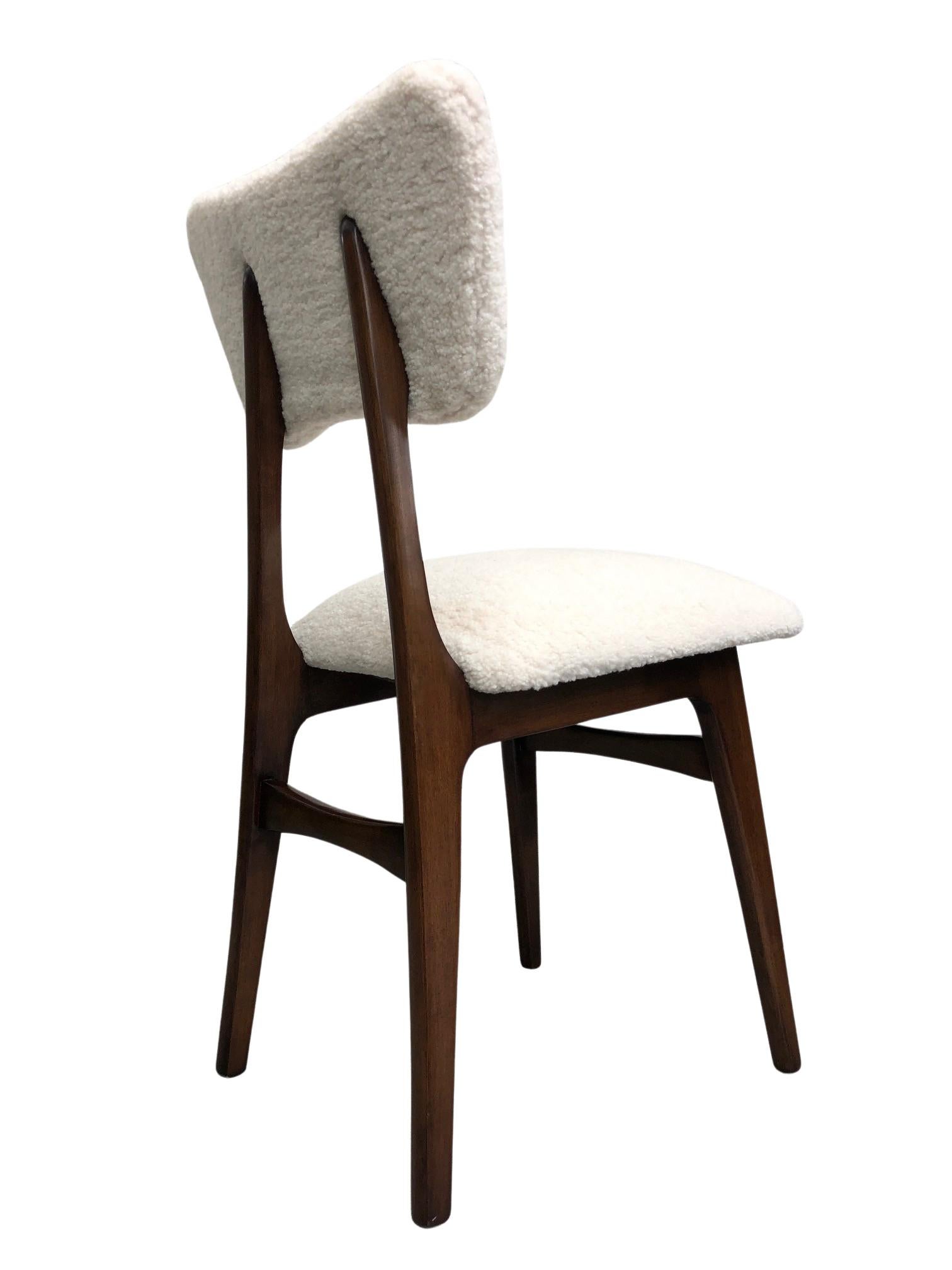 Unique chairs manufactured in Poland in the 1960s, designed by Rajmund Halas. 

The upholstery is made of pleasant to touch bouclé textile. It is high quality and durable italian fabric in a light beige color. The chair structure is made of