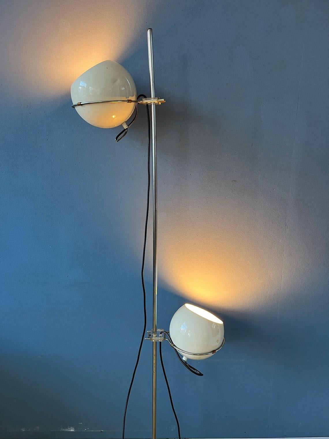 Mid century beige eyeball floor lamp by GEPO. Its distinctive feature is the adjustable eyeball-like shades that can be directed to different angles, allowing you to customize the direction and focus of the light. The shades can also move up and
