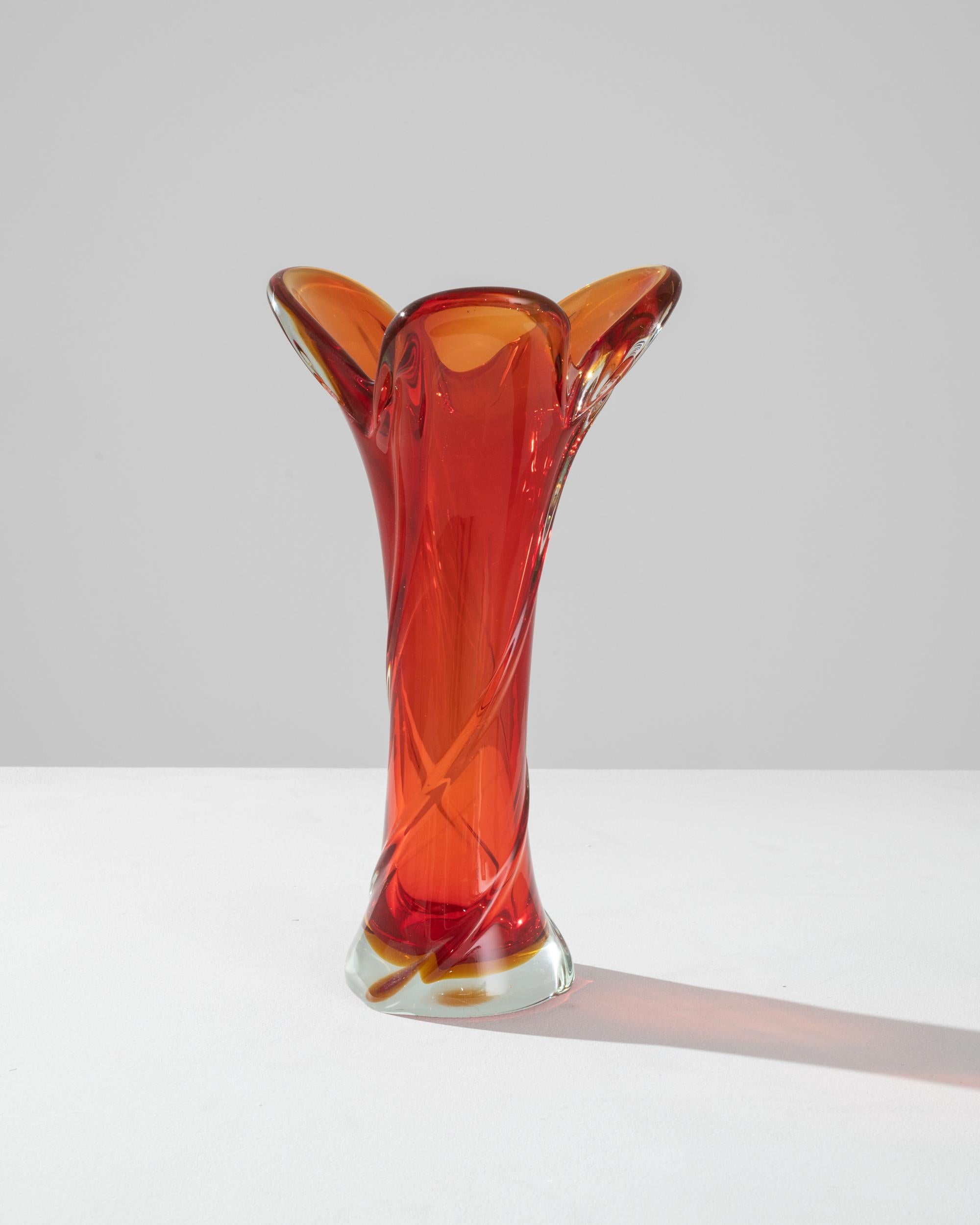 The vivid hues and liquid lines of blown art glass create an unmissable accent. Made in Belgium circa 1960, expressive glasswork forms a bold silhouette. Organic and abstract, reminiscent of cascading water captured in slow motion. A luminous