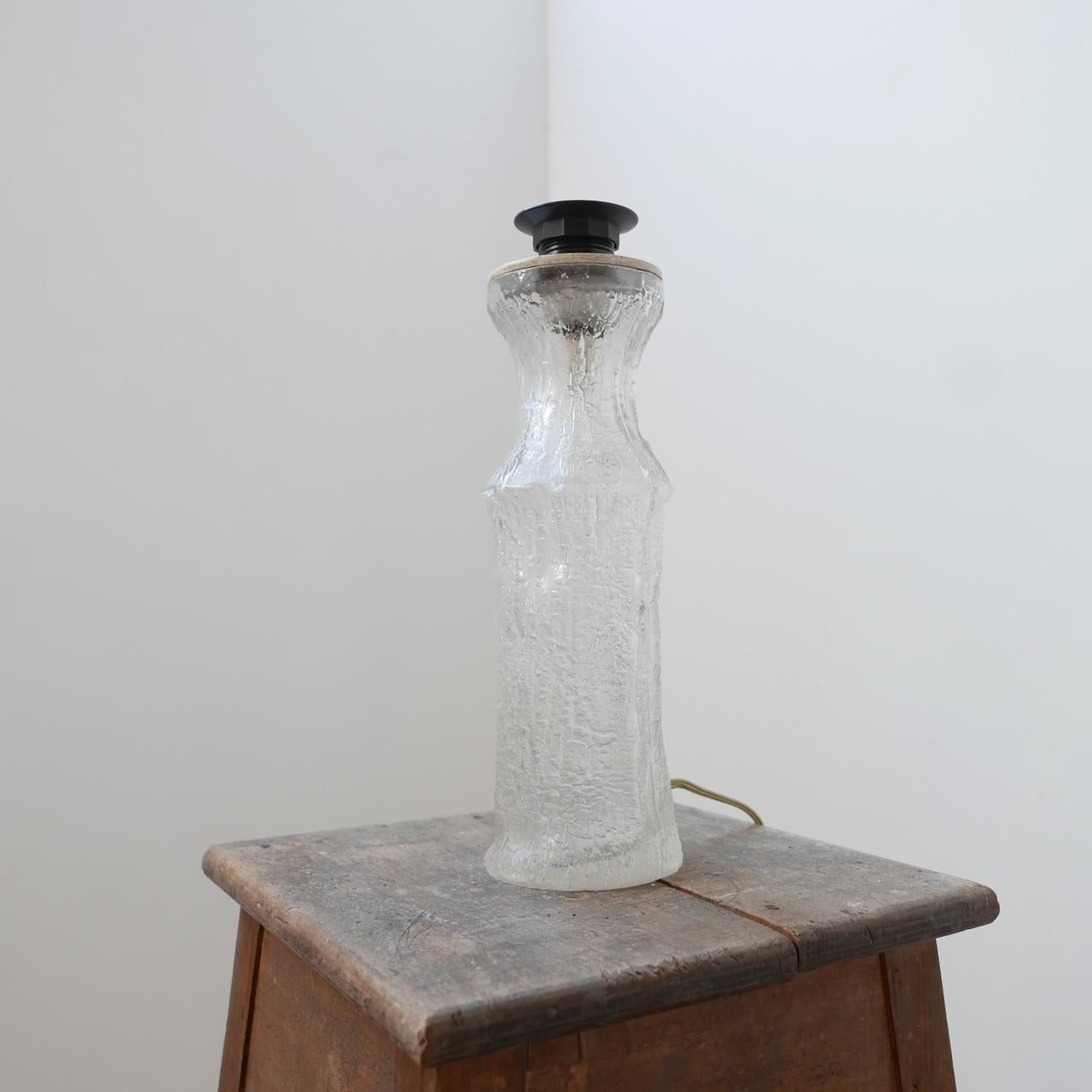 An artistic glass mid-century table lamp. 

Belgium, c1970s. 

Small nick to base, not noticeable but otherwise perfect condition. 

Since re-wired and PAT tested. 

Dimensions: 33 height x 10 diameter in cm.
 