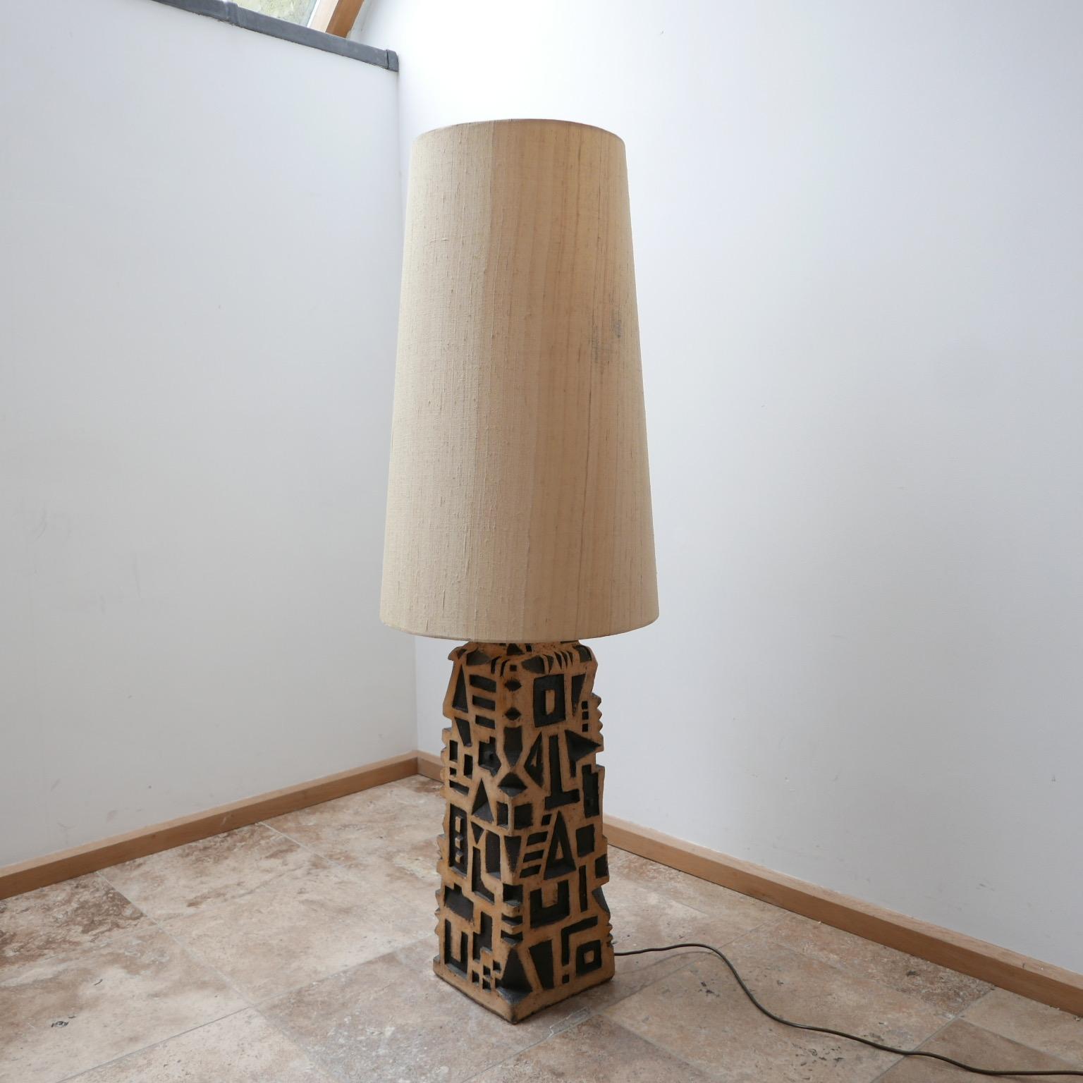 A unique artist made floor lamp. 

Signed internally, c1980s. 

Original shade retained but there are some marks. 

The ceramic pottery base is in good condition. 

Since re-wired and PAT tested. 

Dimensions: With shade 138 height x 44