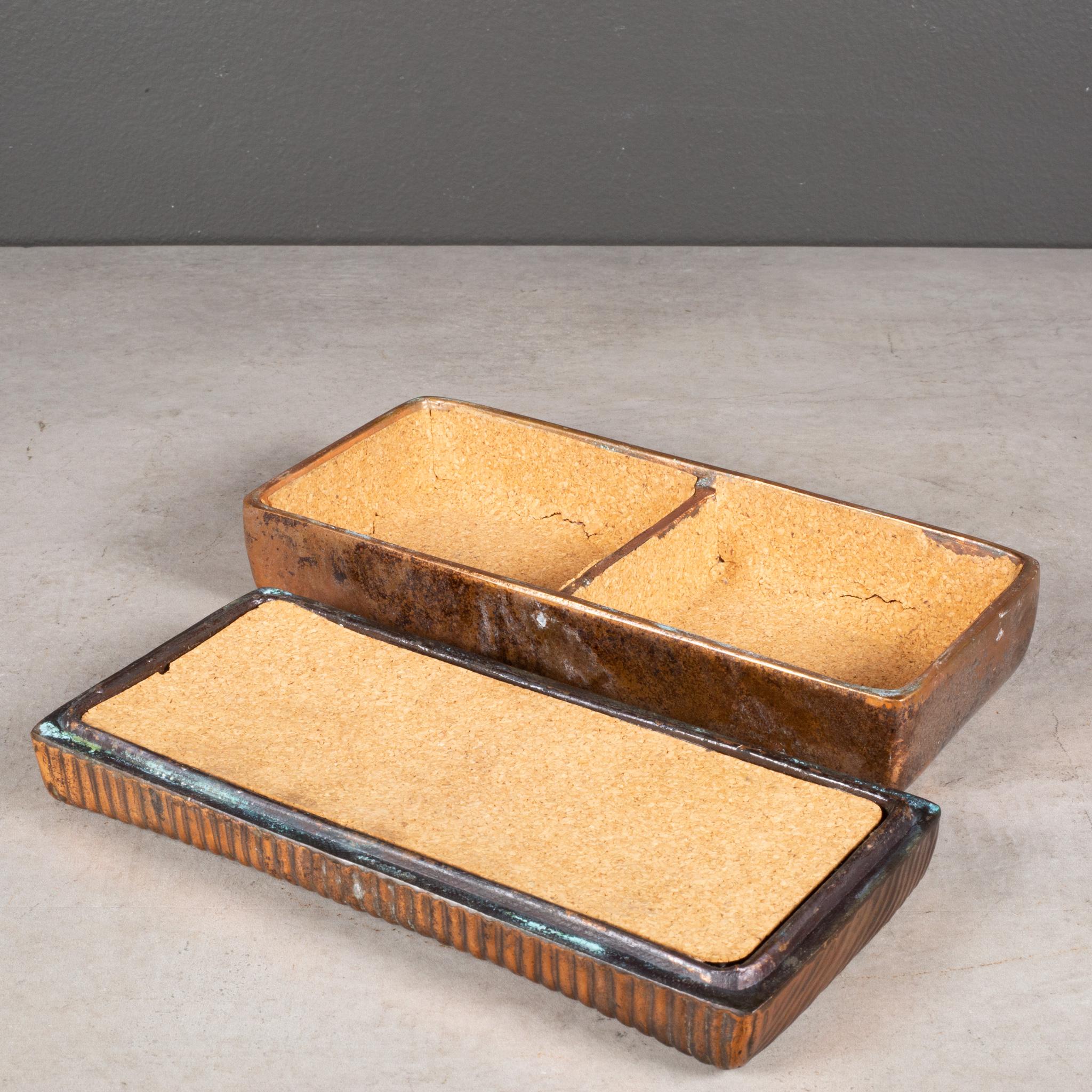 ABOUT

A ribbed copper trinket box lined with cork. Original felt on bottom. 
Substantial in weight.

    CREATOR Ben Seibel for JenFred Ware.
    DATE OF MANUFACTURE c.1960s.
    MATERIALS AND TECHNIQUES Copper, Cork.
    CONDITION Good. Wear