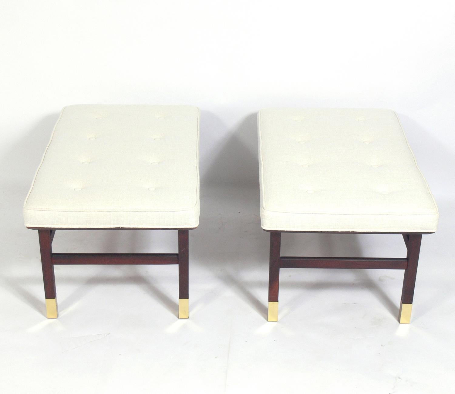 Midcentury bench, attributed to Harvey Probber, American, circa 1960s. It is constructed of walnut and brass and have been reupholstered in an ivory color linen style fabric. They are priced at $1600 each. One has been SOLD. 