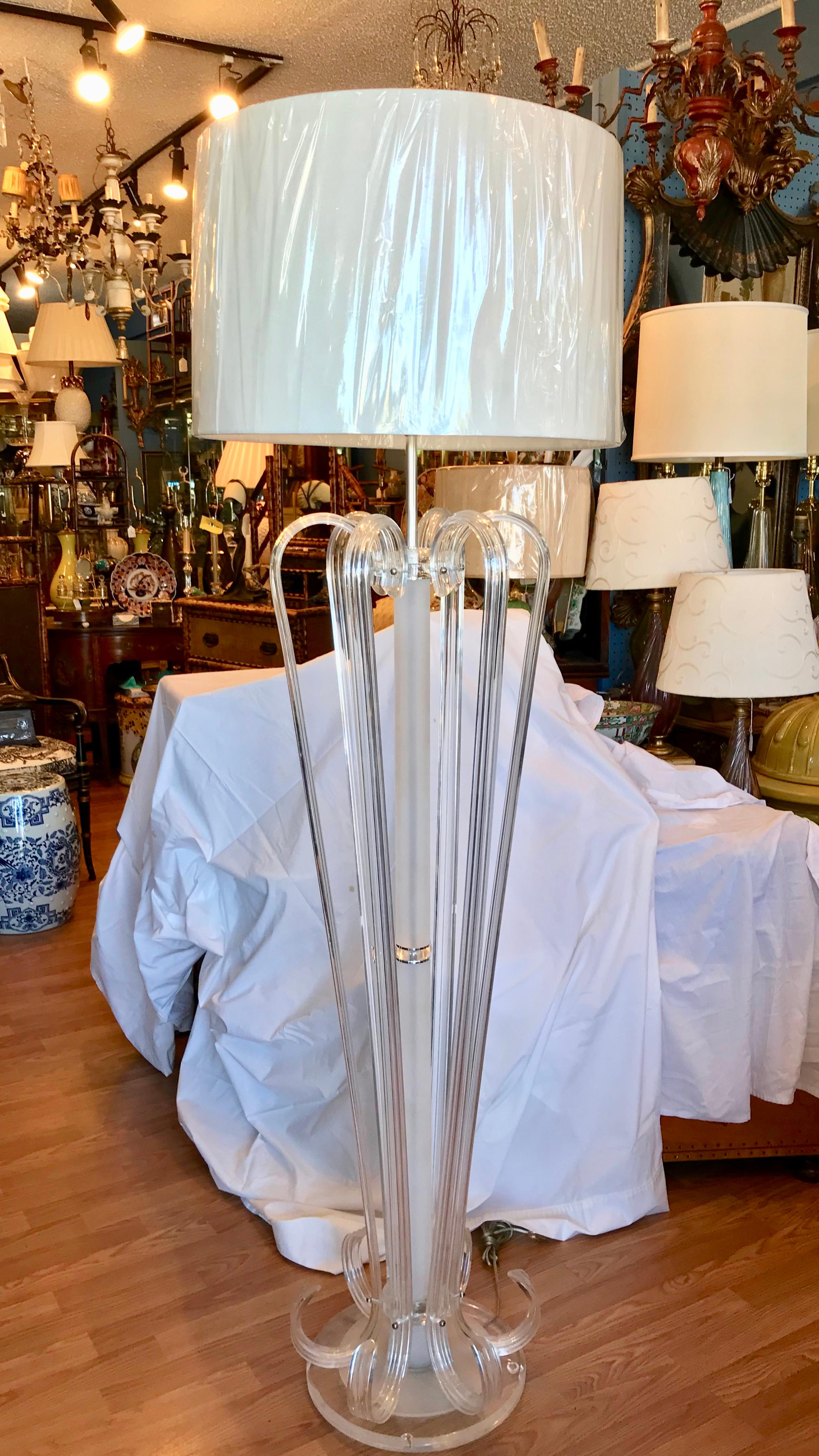 A superb example with Lucite bent in the manner of Dorothy Thorpe.
It resembles Murano glass in the way in which it is so finely fashioned.
Dramatic in scale and form, and capped with its original tall Lucite finial.
The 21