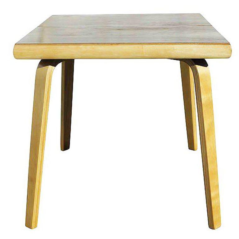 A rare steam-formed bent plywood dining table designed by Herbert Von Thaden and Donald Lewis Jordan for their company, Thaden-Jordan Furniture. This table is a rare early square-shaped table that was produced in limited numbers. This table is